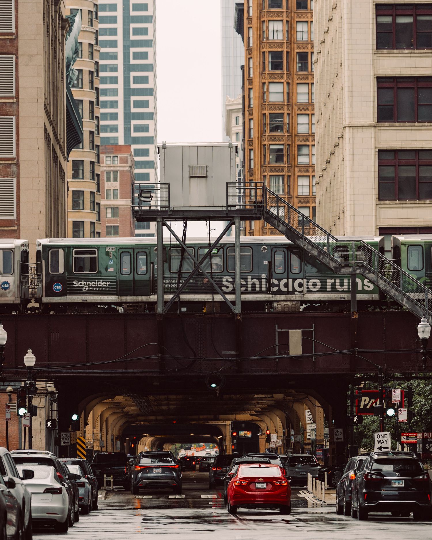 CTA elevated train passing through downtown Chicago architecture
