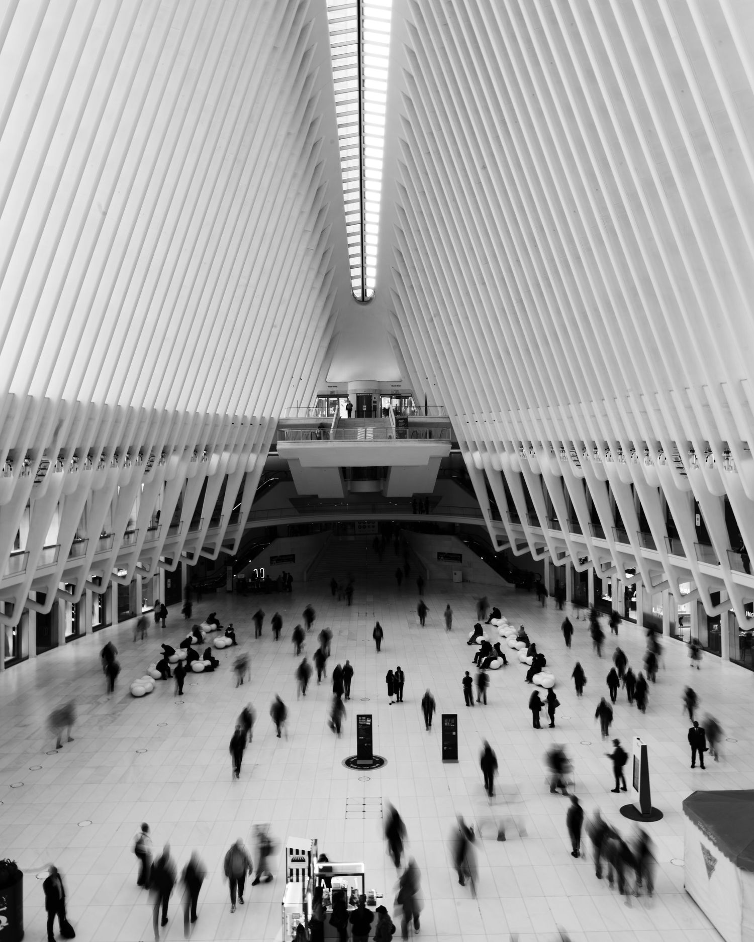 Black and white view of commuters inside the Oculus at the World Trade Center in New York City