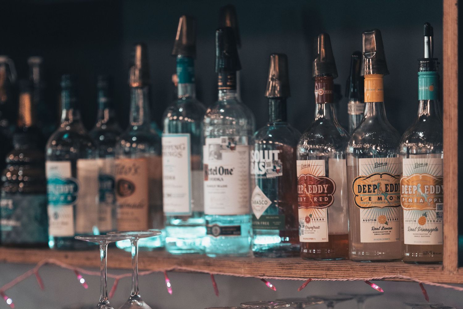Selection of spirits displayed behind the bar at Halcyon Coffee, Bar & Lounge in downtown Austin