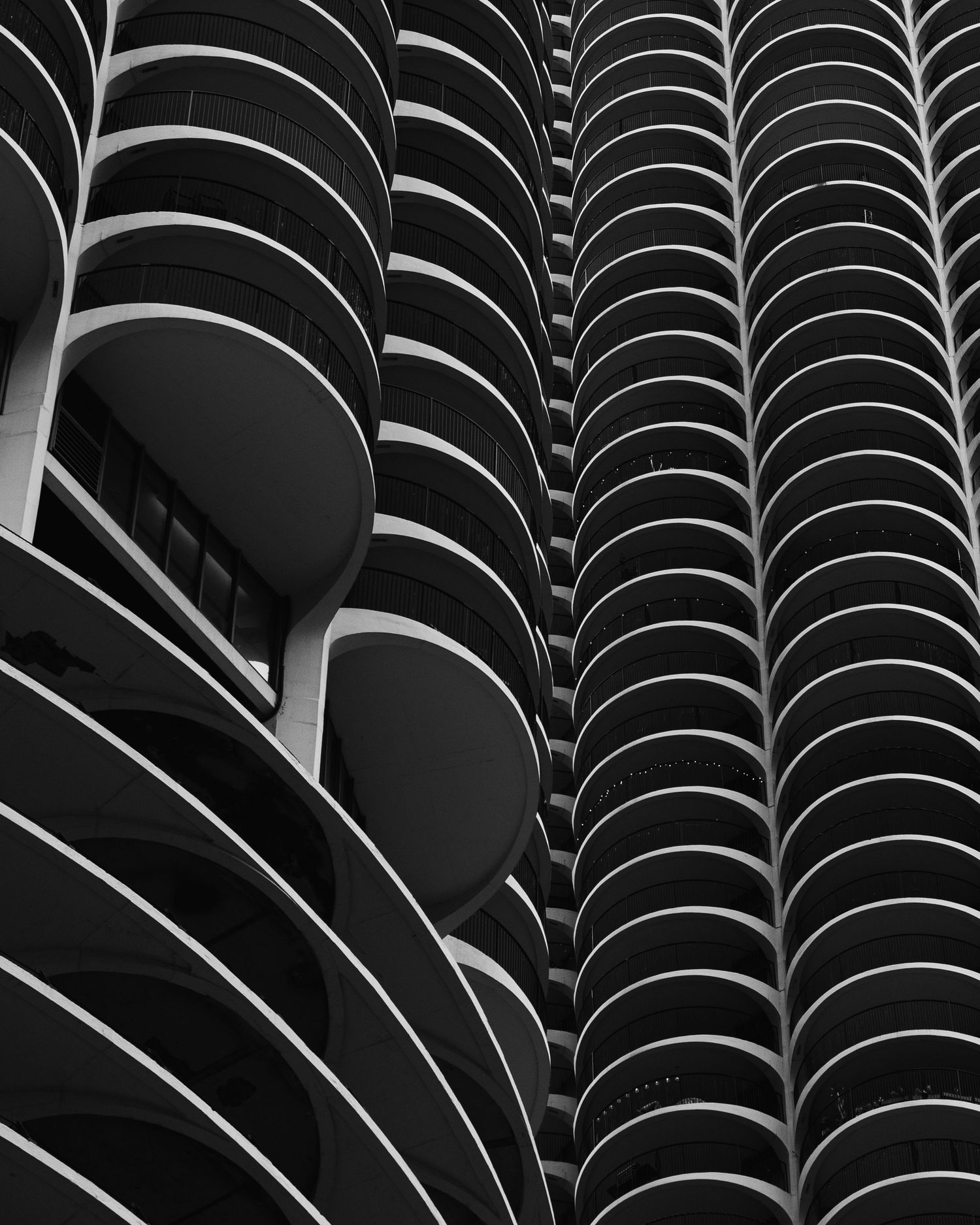 Black and white architectural detail of the curved balconies of Marina City in Chicago