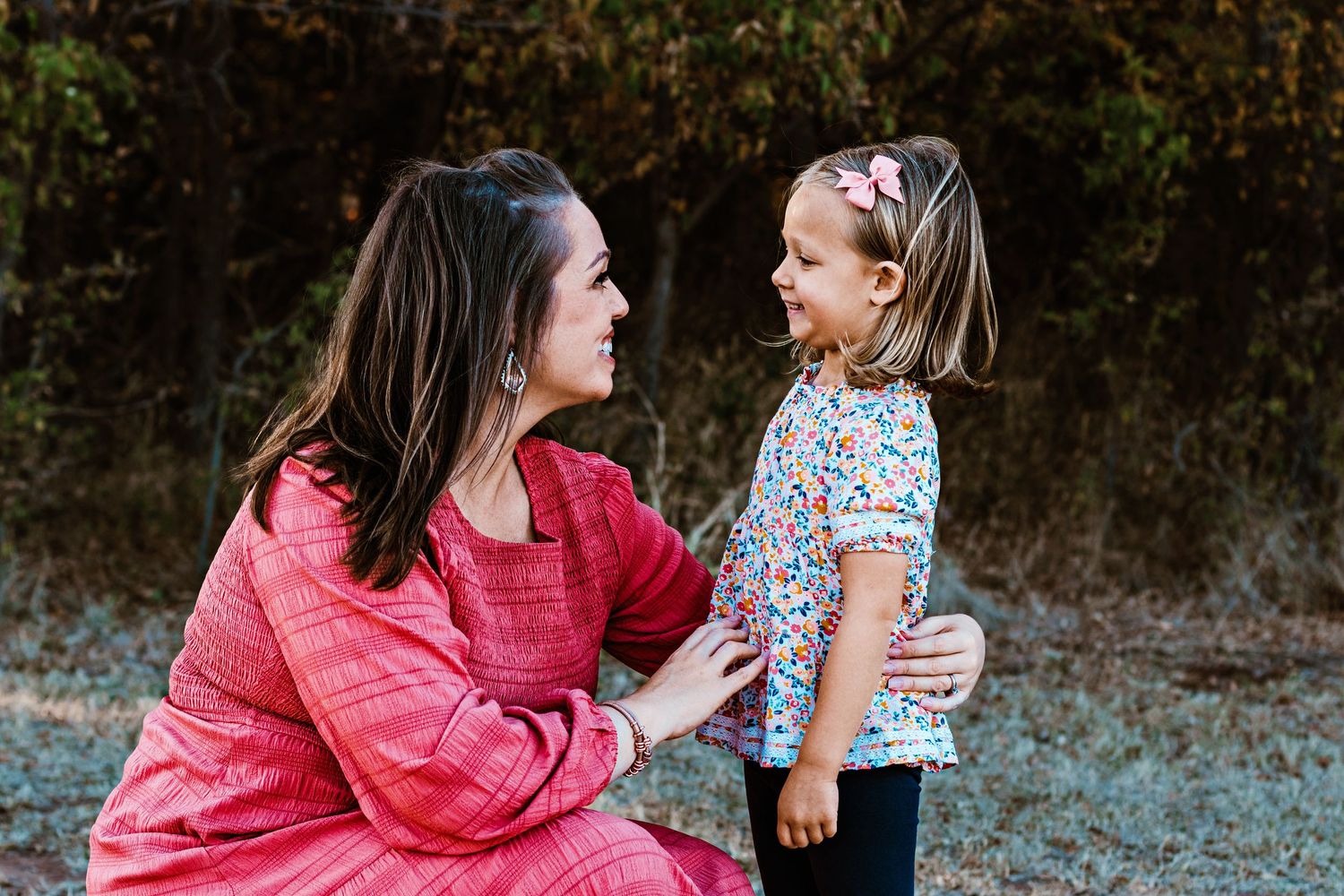 A series of candid outdoor family photos showing tender moments between parent and child in casual attire.