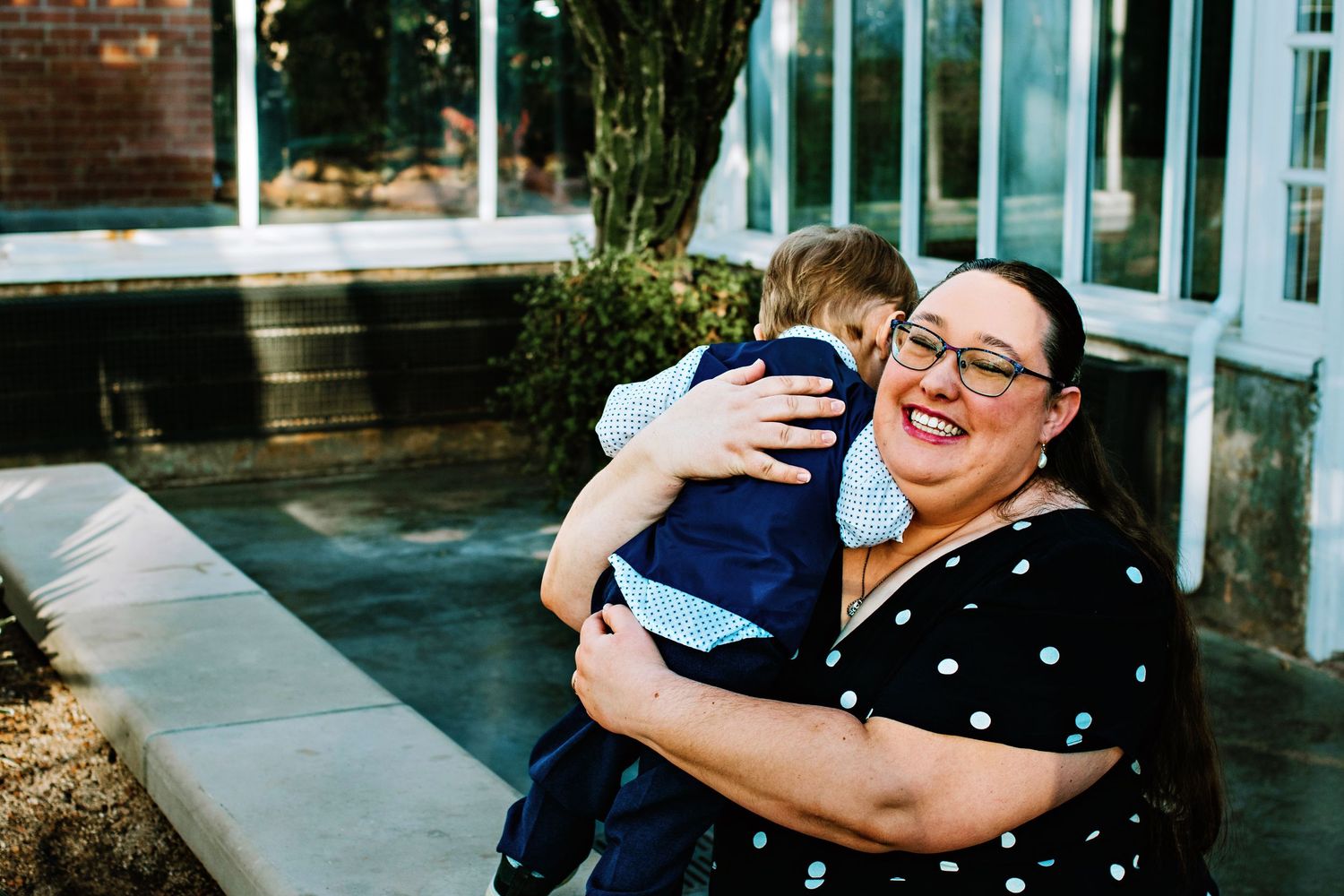 A series of candid moments showing people embracing and celebrating at a joyful outdoor gathering.
