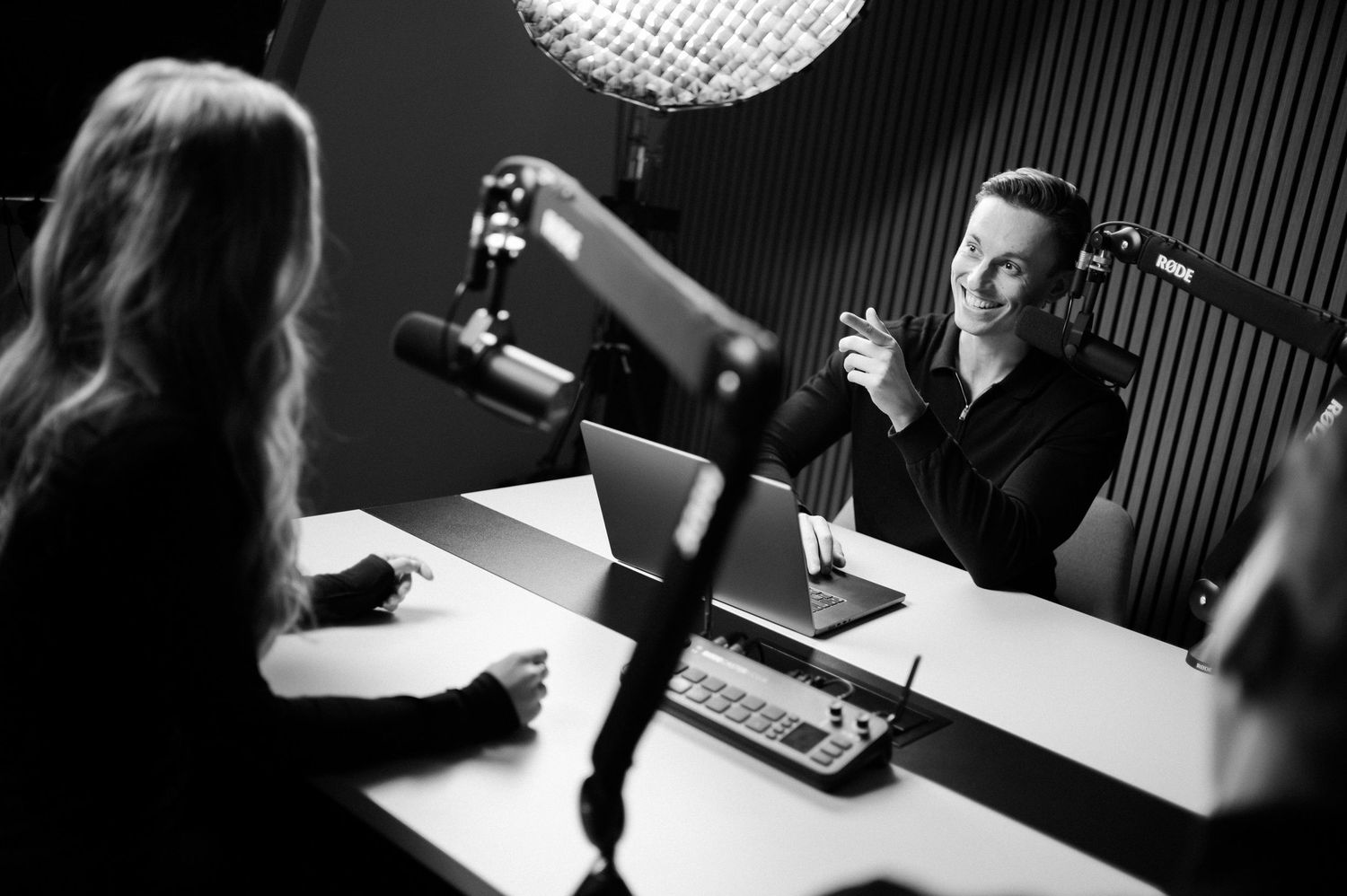 Professional recording studio setup with microphones and lighting equipment.
