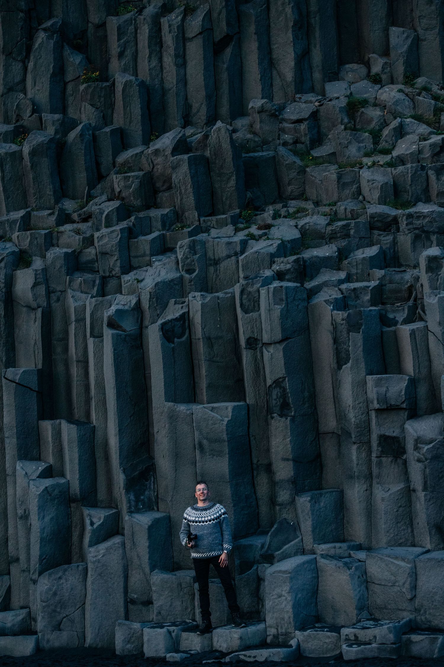 Dramatic basalt columns form a geometric wall of dark volcanic rock at Giant's Causeway in Northern Ireland.