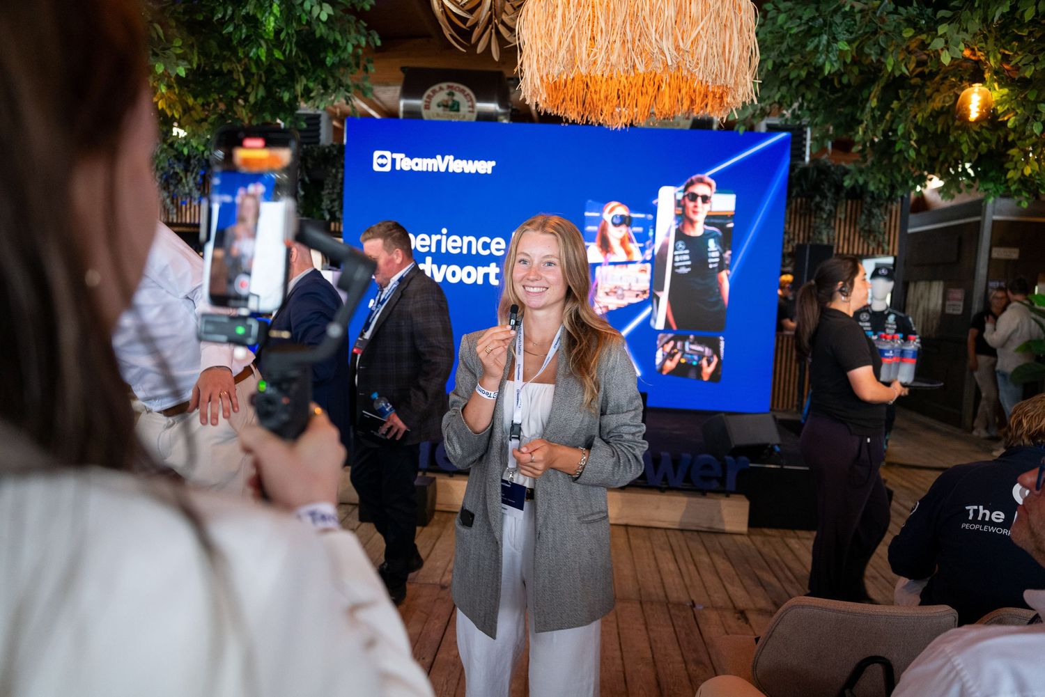 Corporate event setup with TeamViewer branding and blue banners in outdoor venue.