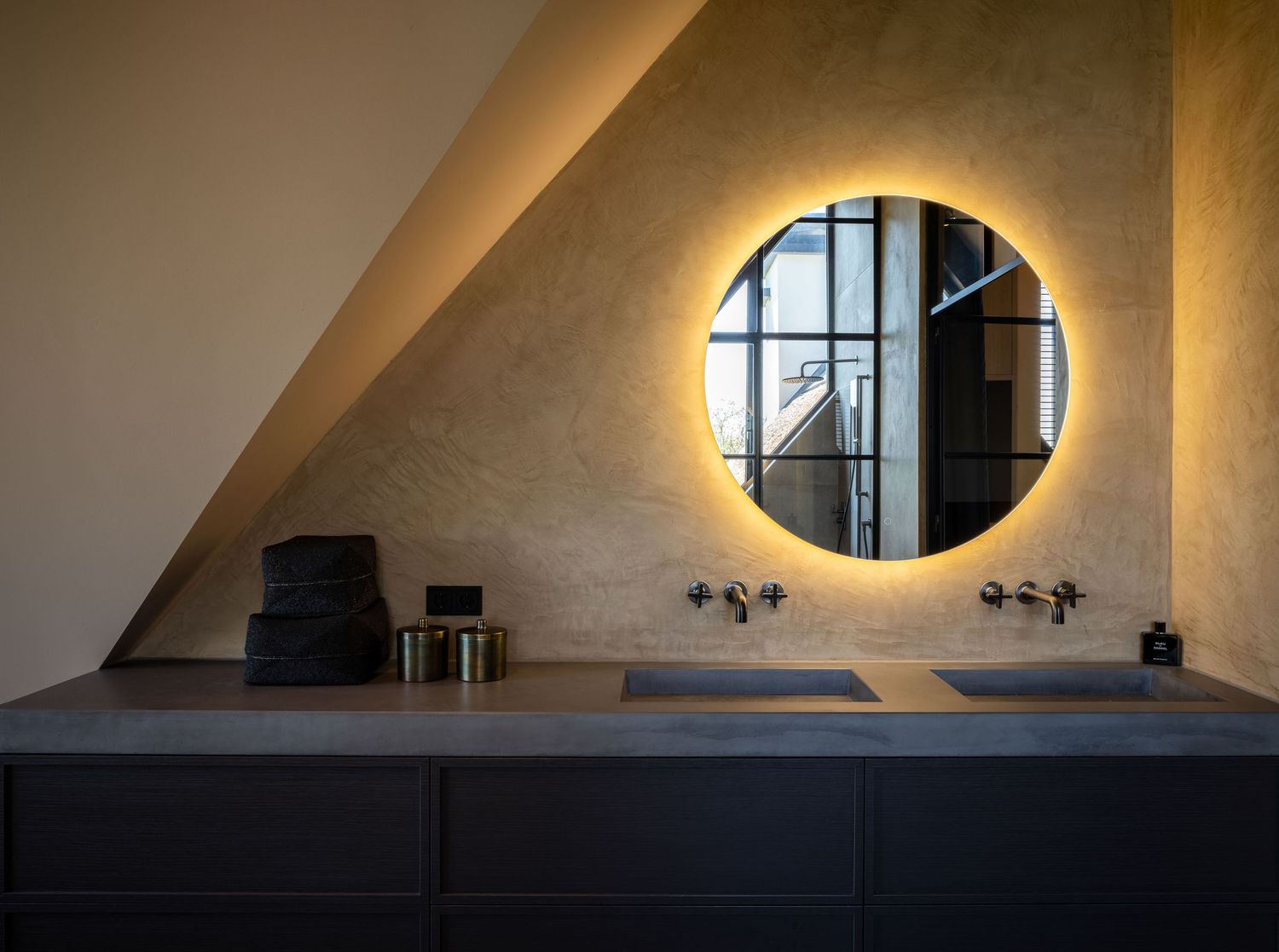 Curved concrete ceiling with round window creates dramatic lighting and architectural interest in modern interior space.