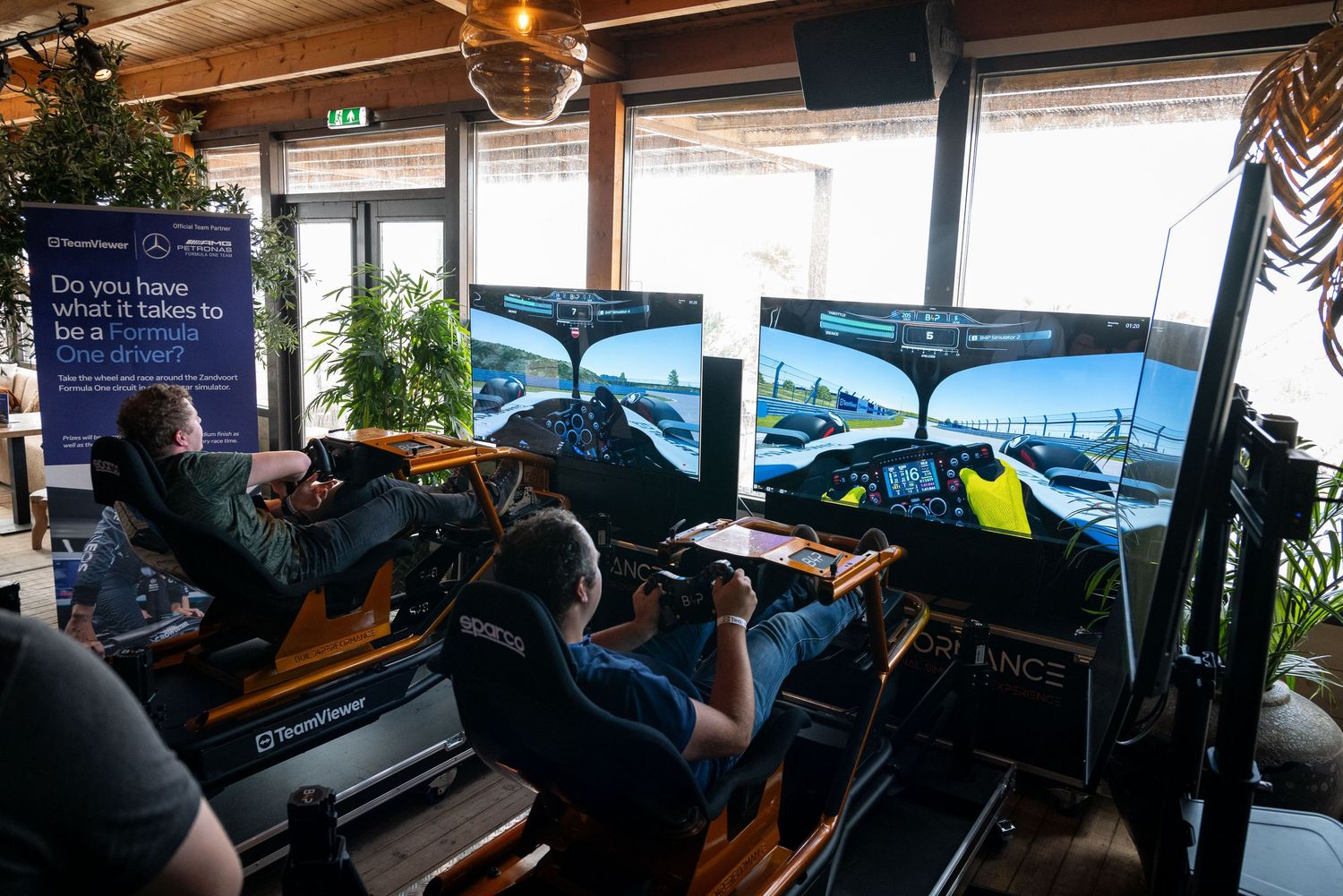 Business professionals engaging with virtual reality headsets in a modern office setting.