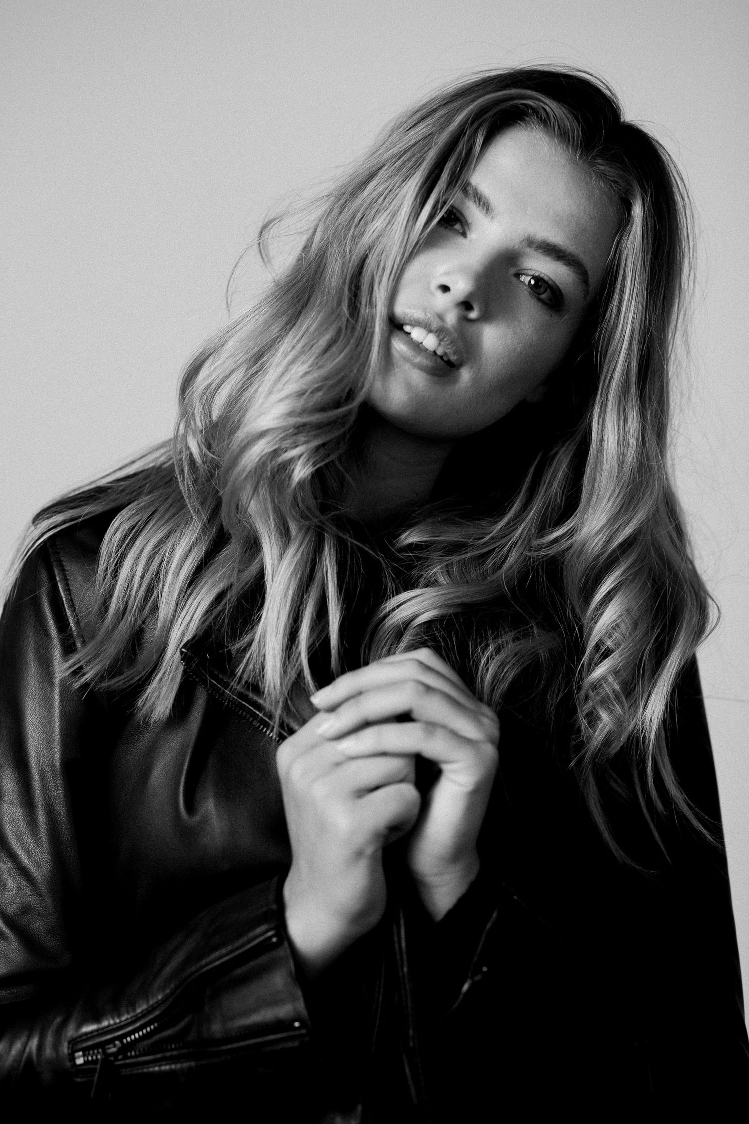 Artistic black and white portrait series with dramatic lighting and poses.