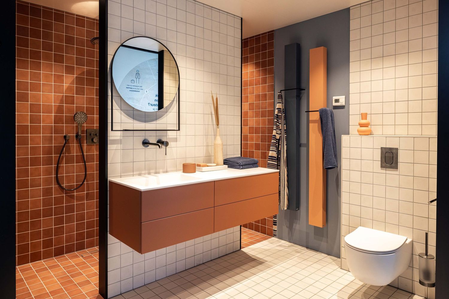 Contemporary bathroom design with white tile walls, modern fixtures, and circular window creates a minimalist aesthetic.
