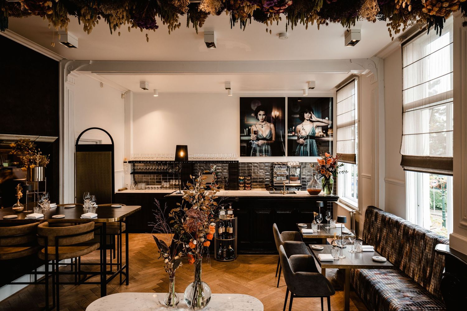 A collection of interior photos showing a modern restaurant dining room with dark wood tables and natural lighting.