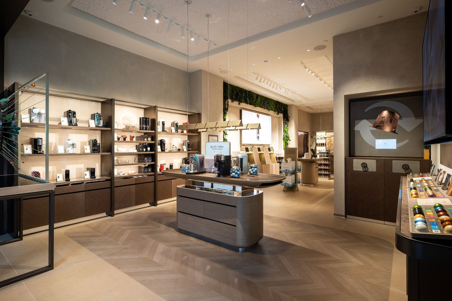 Modern retail interior with sleek display cases and minimalist lighting design.