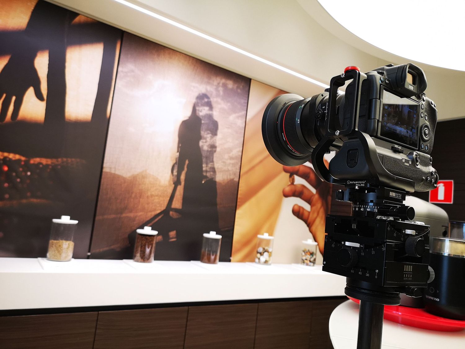 Video production equipment and cameras set up for filming in a studio setting.