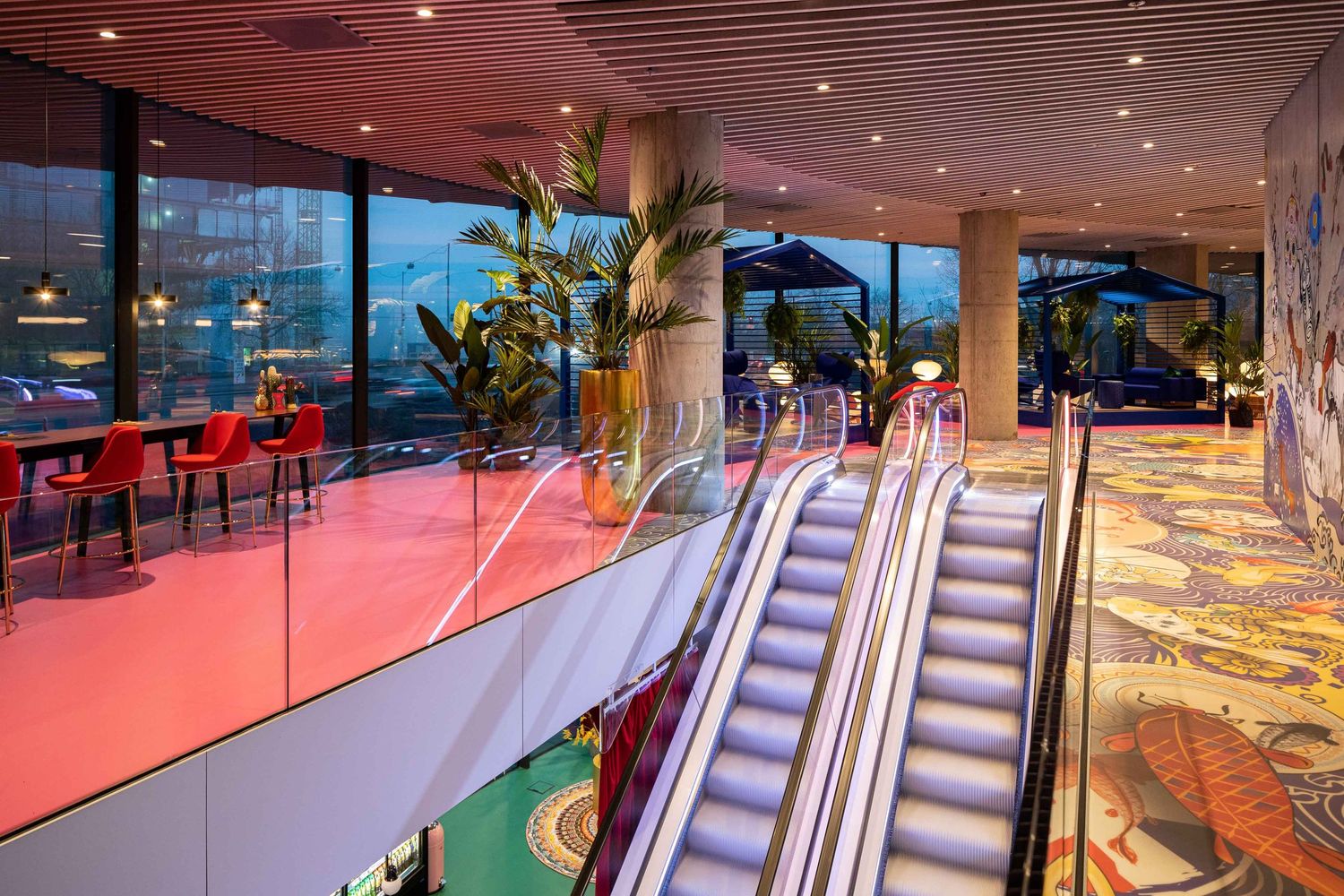Modern indoor bowling alley with neon lighting and multiple lanes featuring sleek design and contemporary decor.