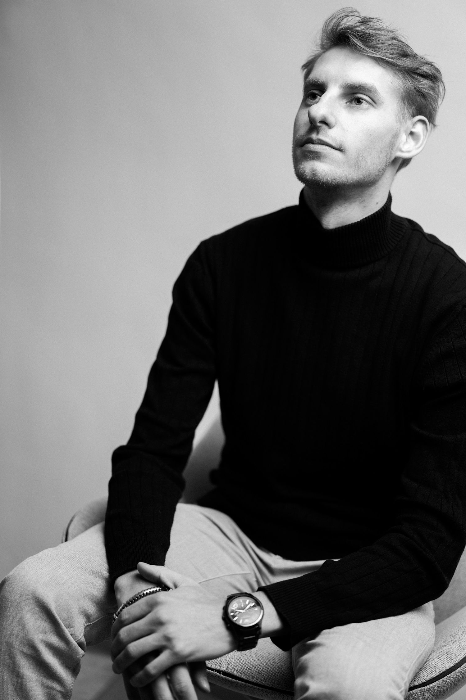 Professional black and white portraits with dramatic lighting and poses.