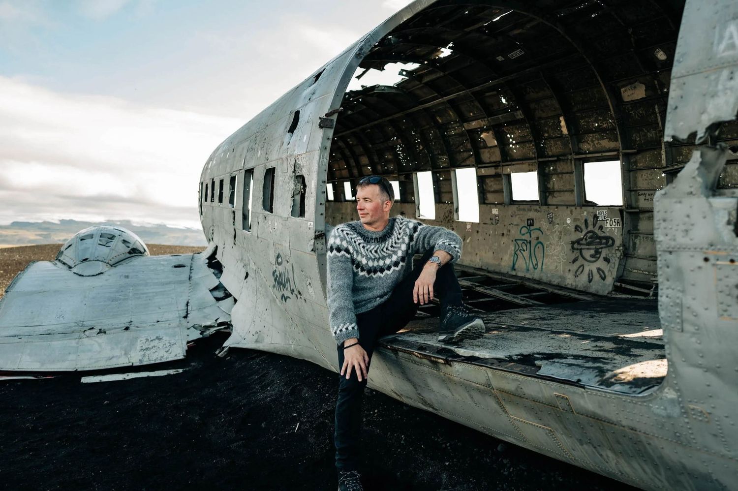 Interior views of an abandoned aircraft wreckage with broken windows and damaged fuselage.