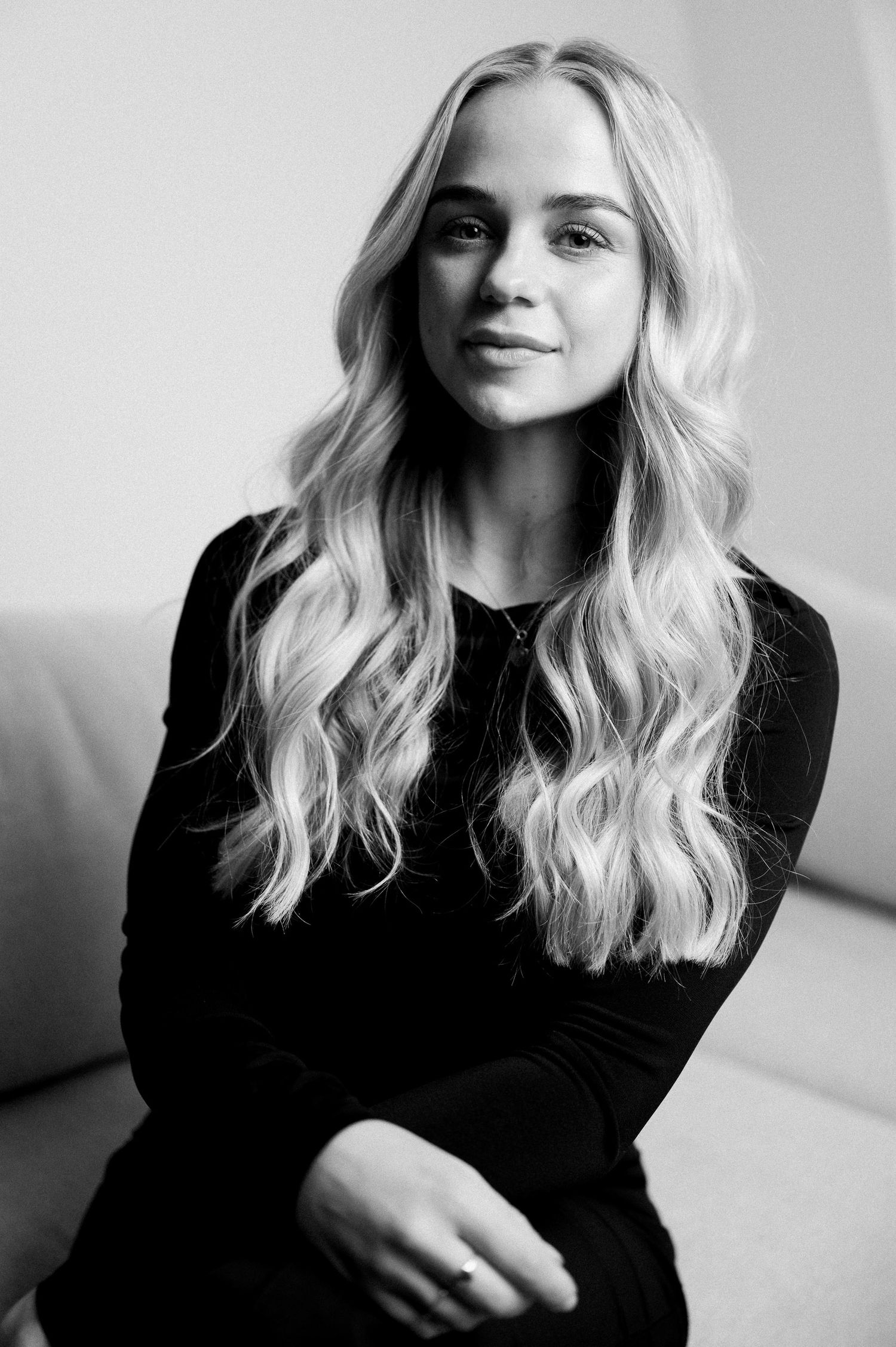 Black and white portrait series showing different expressions and angles.