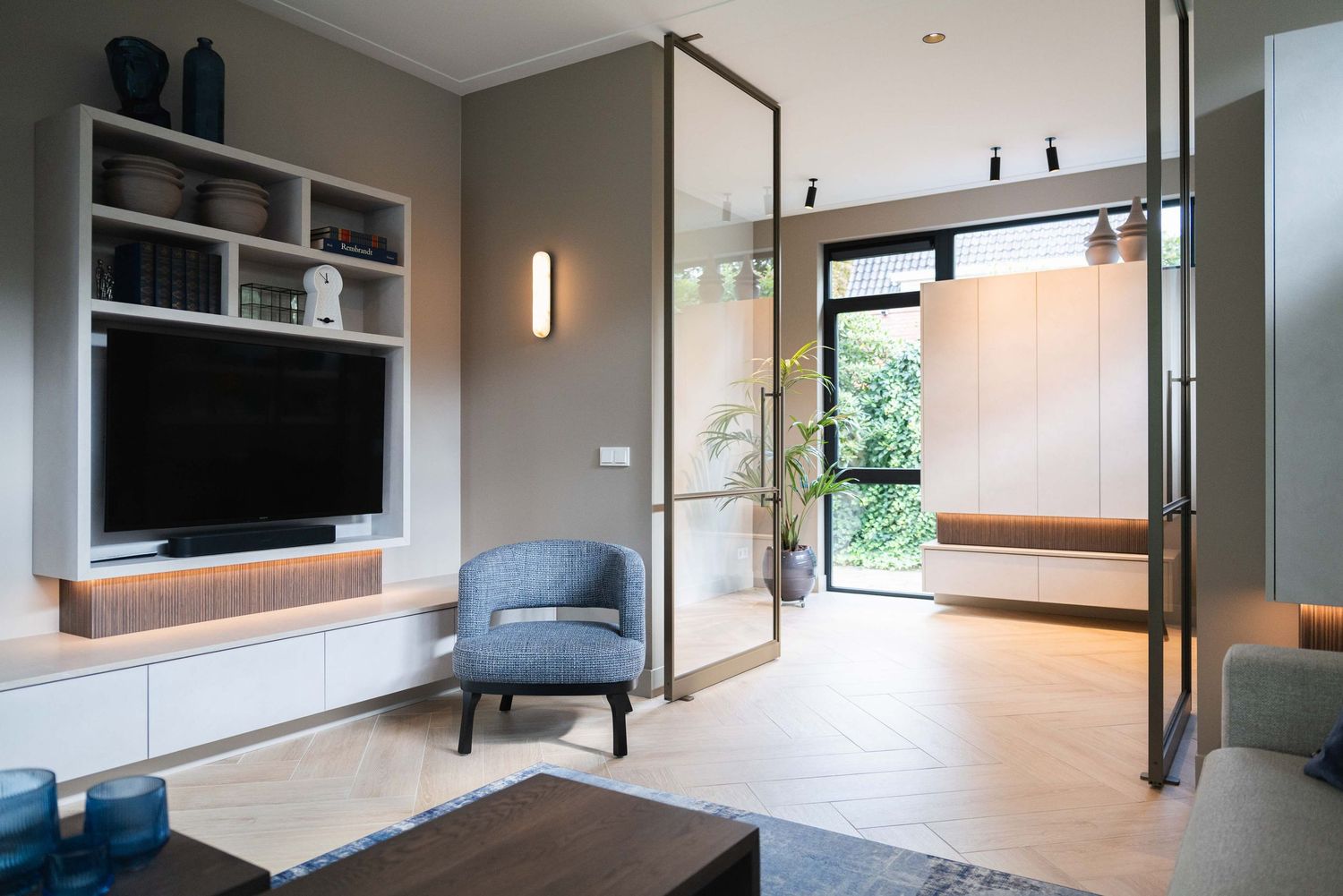 Modern interior design features sleek floating cabinets and minimalist decor in an open-concept living space.