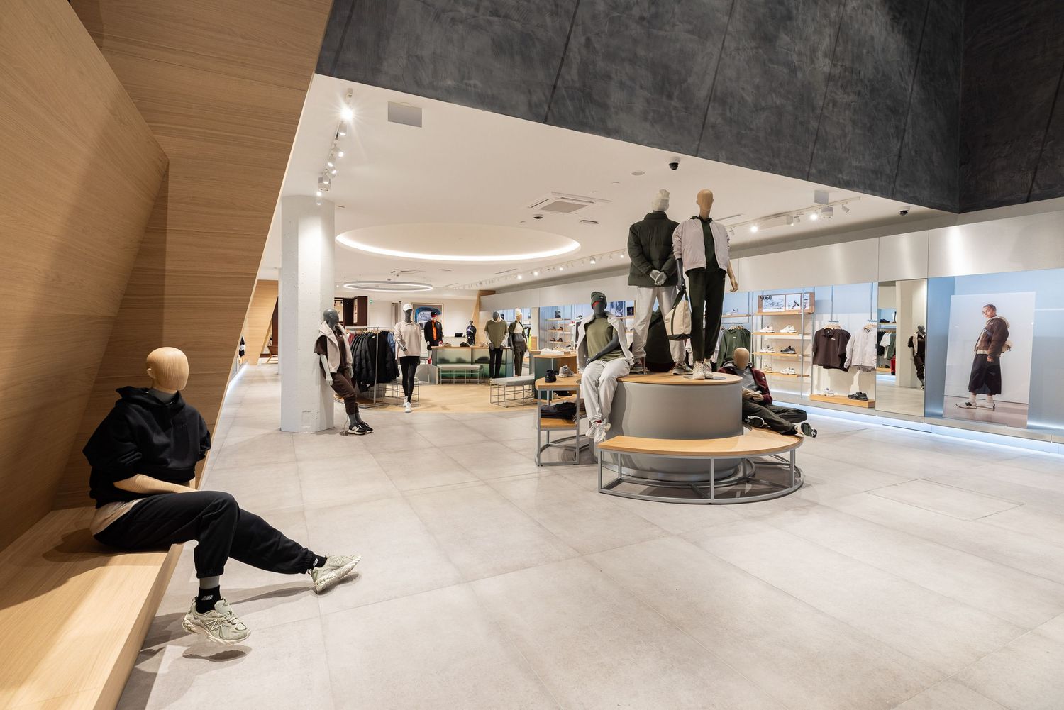 Spacious retail store interior with concrete floors and modern architectural elements.