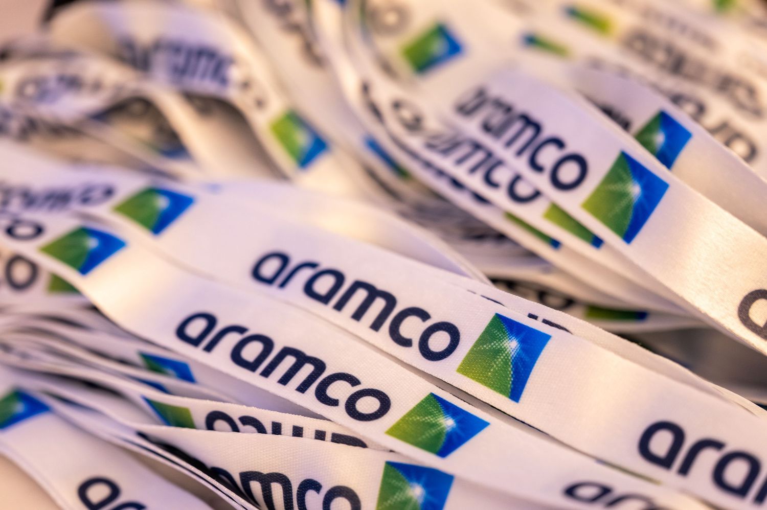 Close-up of Aramco branded lanyards with Swedish flag colors.