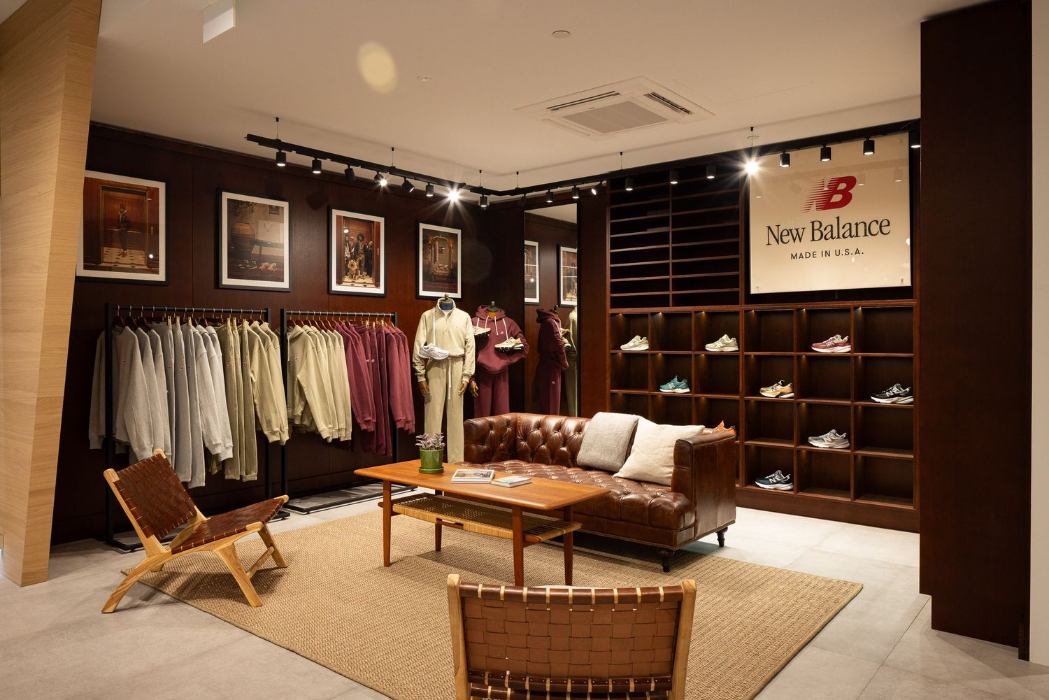 Interior view of a high-end retail clothing store with wood paneling and elegant display fixtures.
