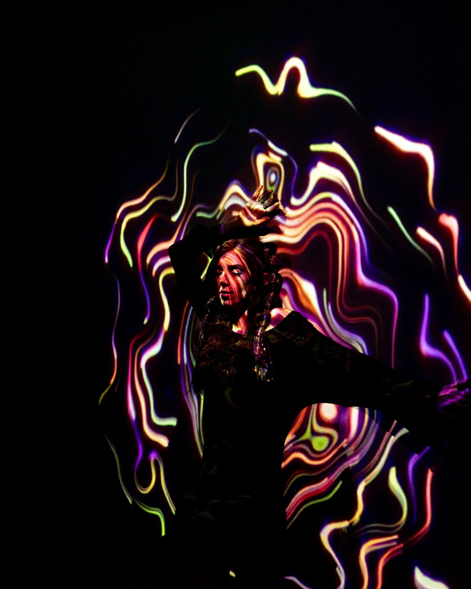 lady in a wave of colored lights