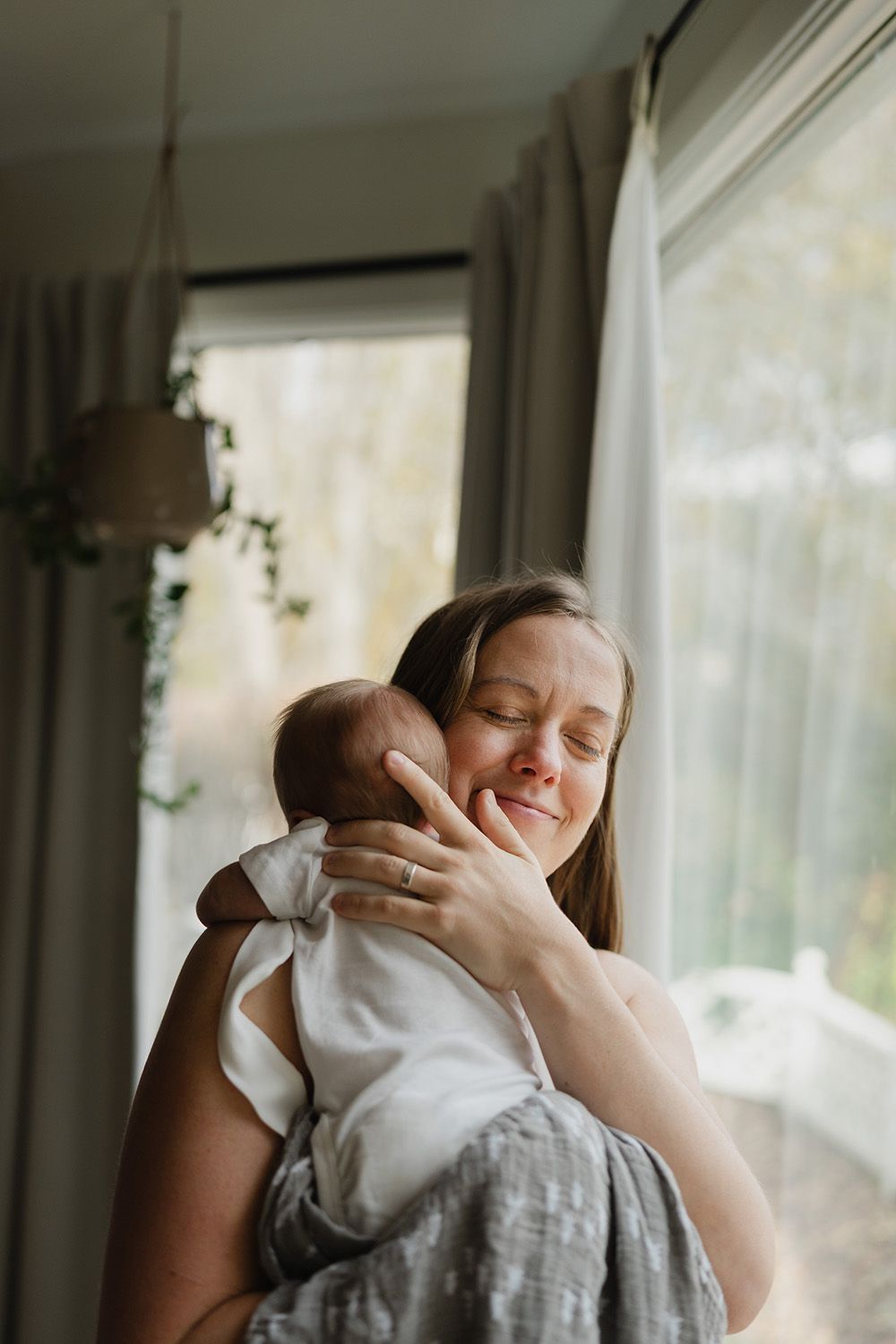 A mother with her newborn baby at home in Fredericton, New Brunswick