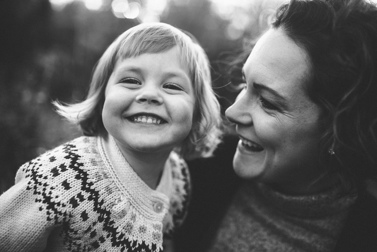 Mother & daughter smiling during family photos in Fredericton, NB