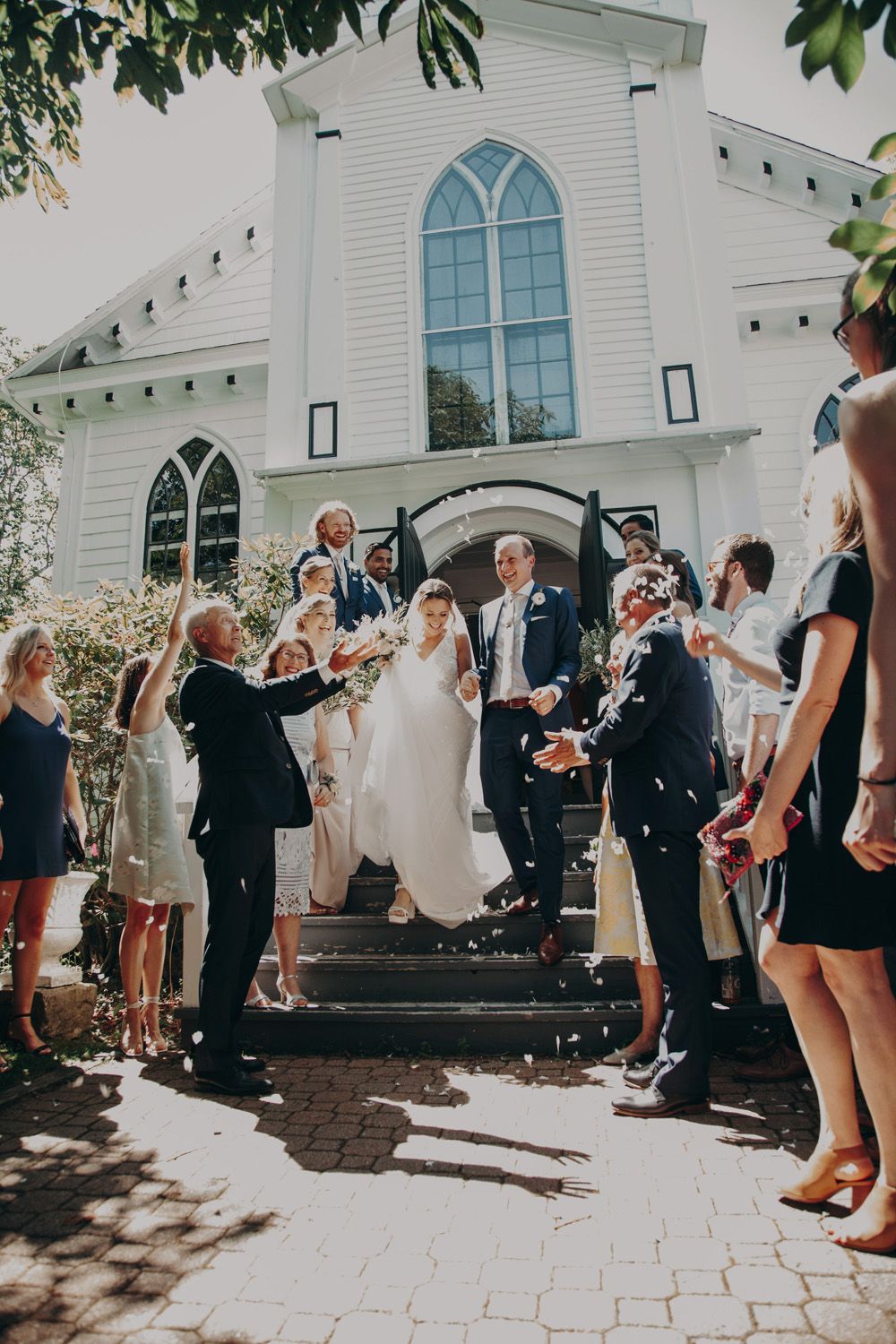Couple exiting the church after their Chester, Nova Scotia wedding