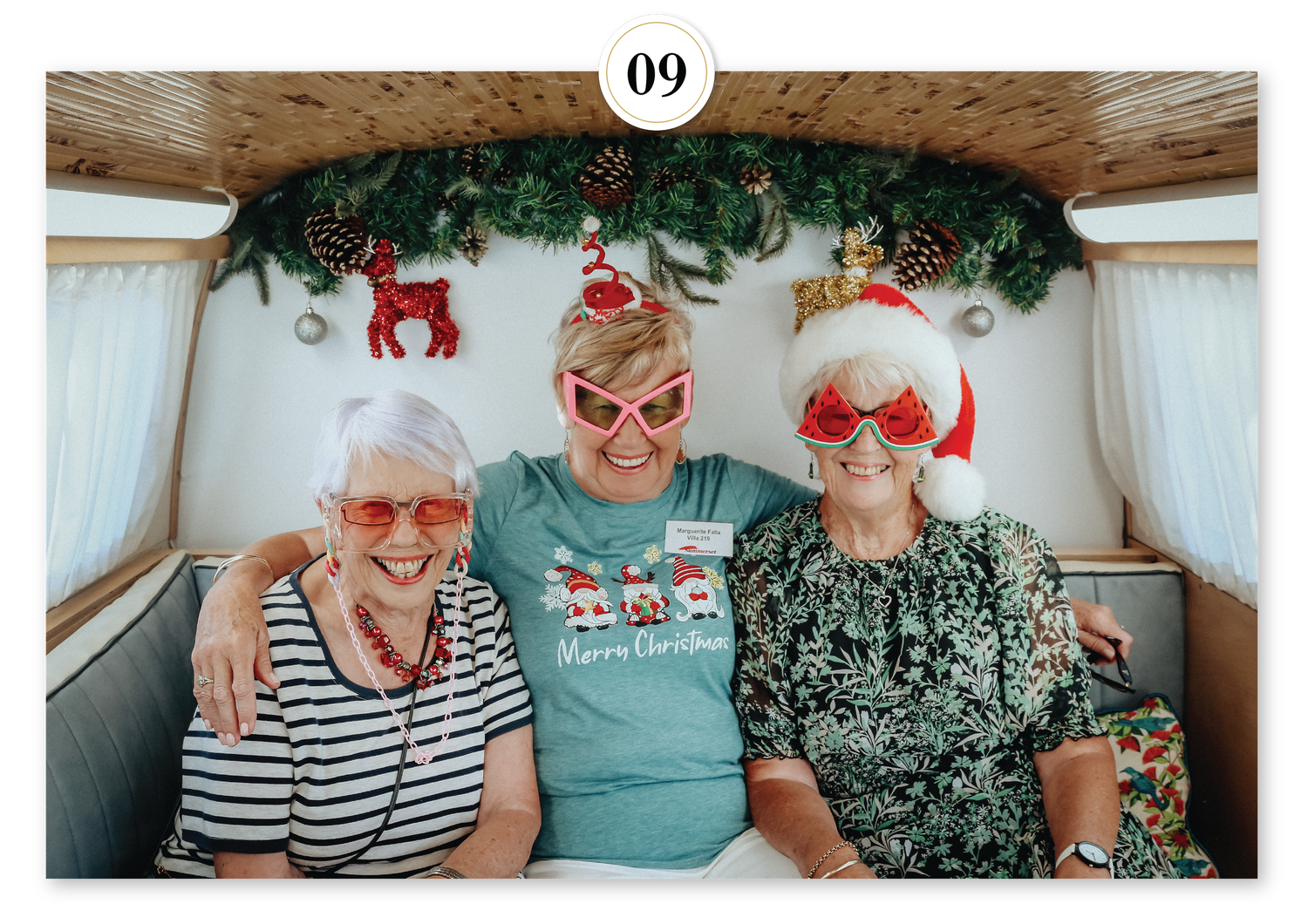 Festive holiday photo booth backdrop featuring Christmas décor and greenery, perfect for seasonal parties and celebrations.
