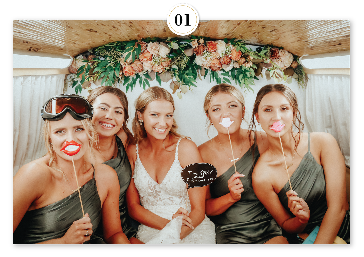 Elegant floral photo booth backdrop featuring lush greenery and soft blooms, perfect for weddings and celebrations.