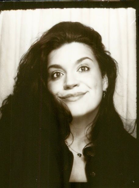 A black and white photo series shows a person with dark hair making playful expressions against a light background.