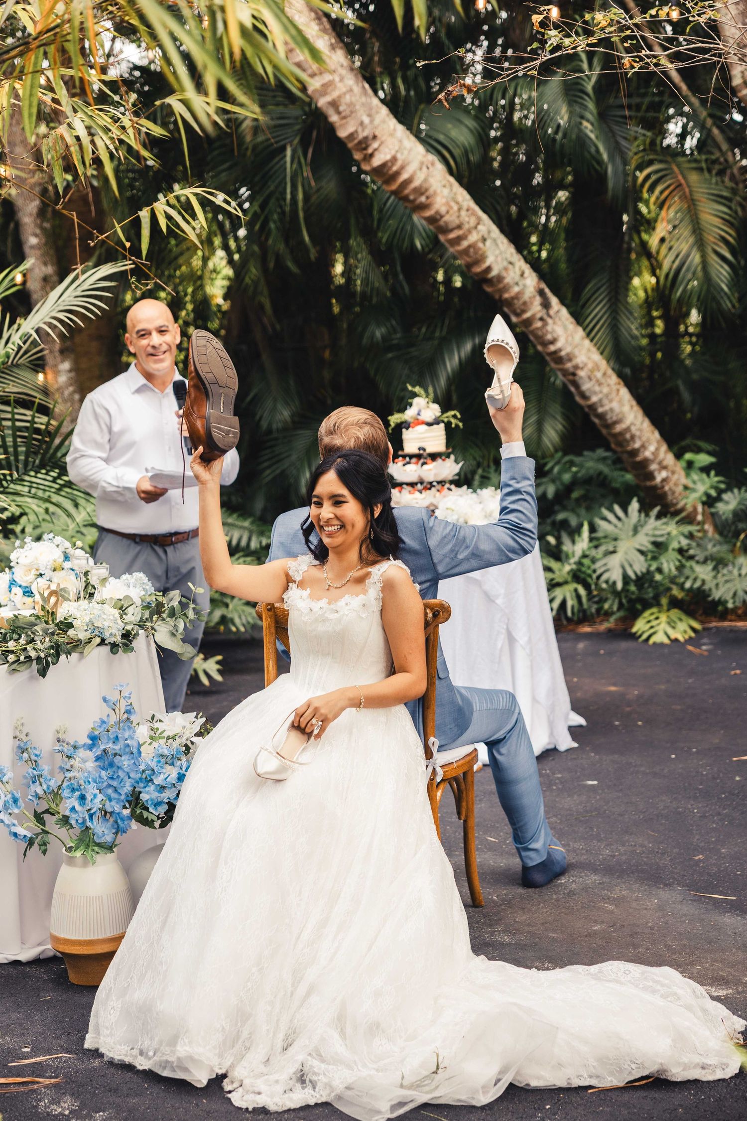 Bride laughing during fun wedding reception moment in Palm Beach Gardens