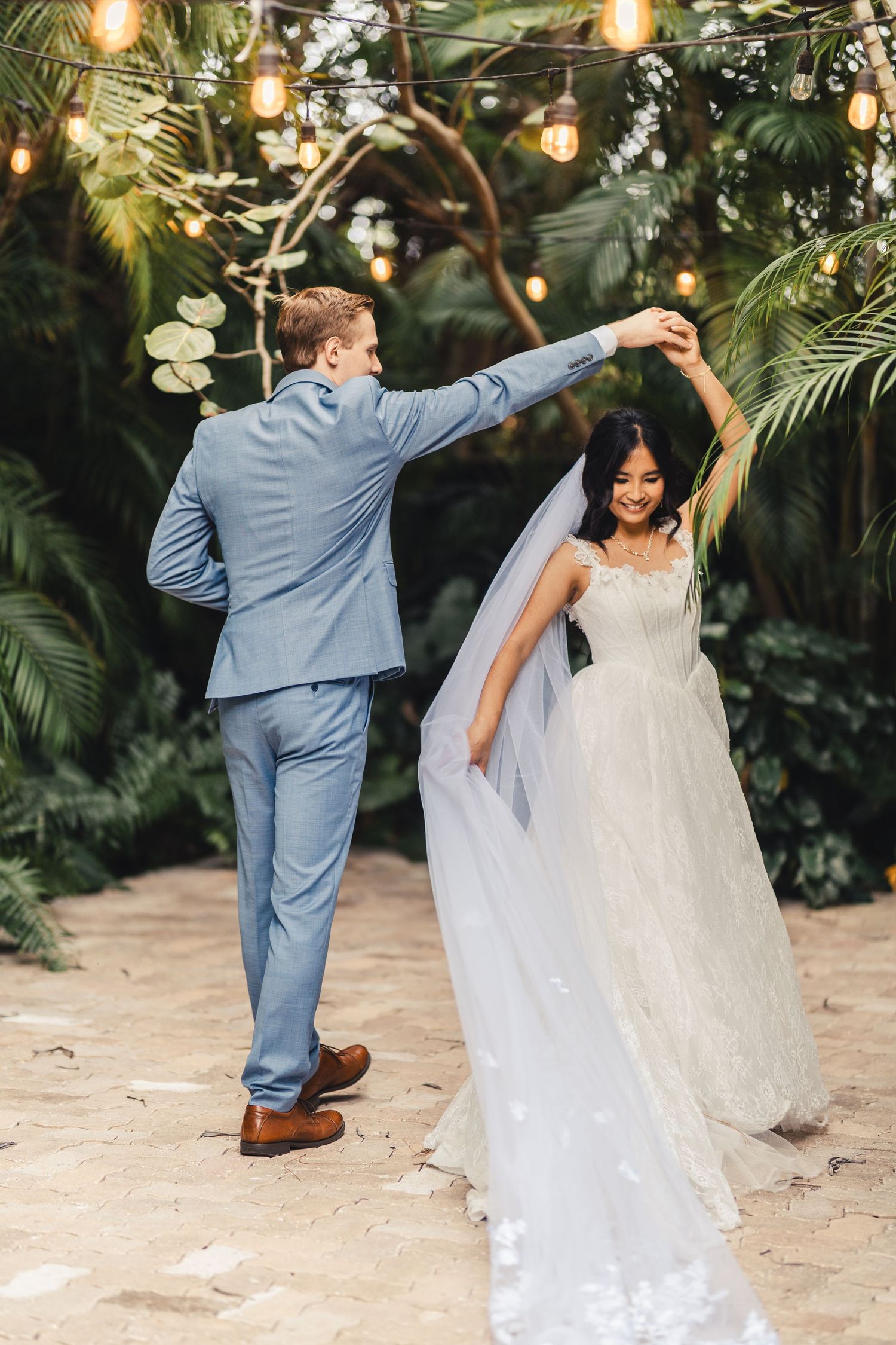 Bride and groom dancing during wedding portrait in Palm Beach Gardens