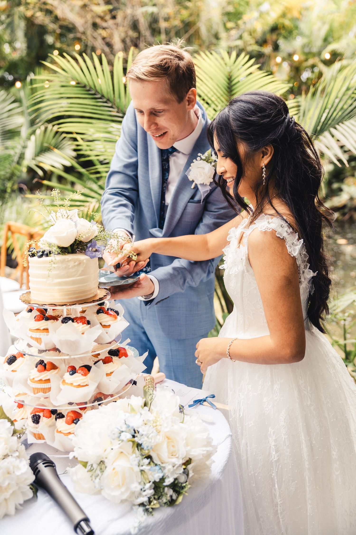 Bride and groom cutting cake during wedding reception in Palm Beach Gardens
