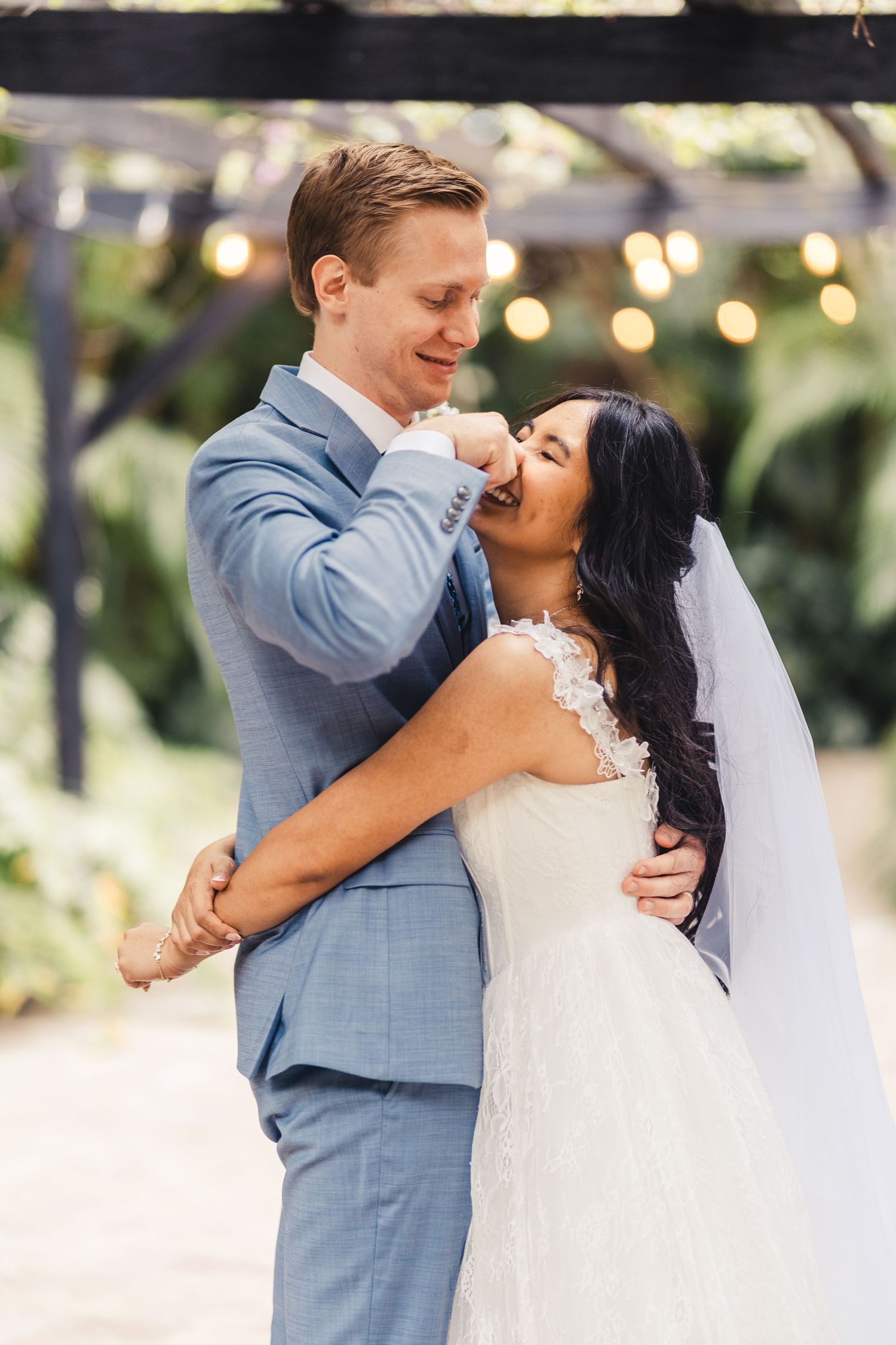 Bride and groom embracing during romantic wedding portrait in Palm Beach Gardens