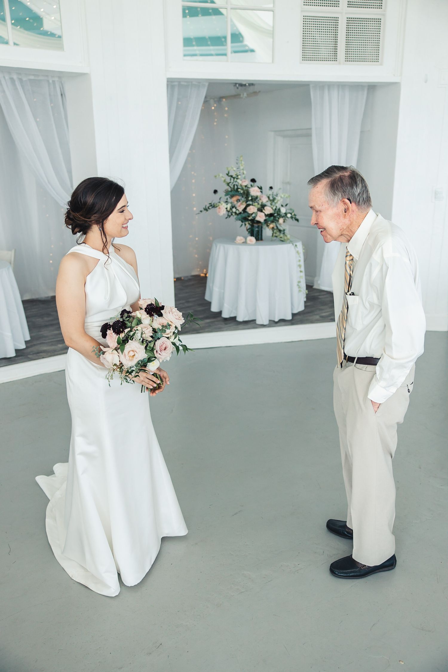 Bride sharing a special moment with her grandfather before ceremony in Palm Beach Gardens