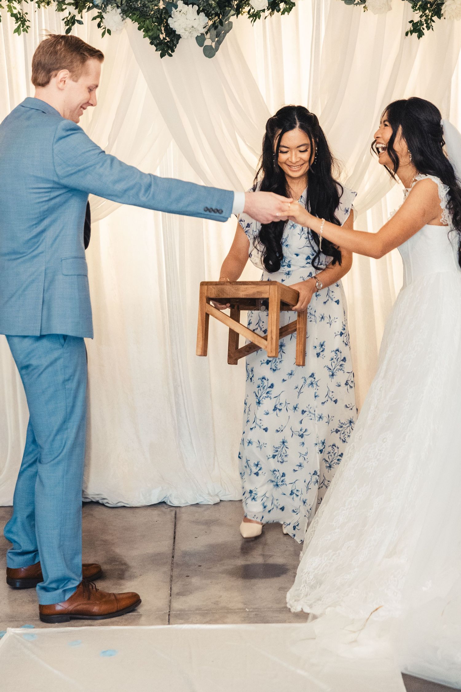 Bride and groom holding hands during wedding ceremony in Palm Beach Gardens