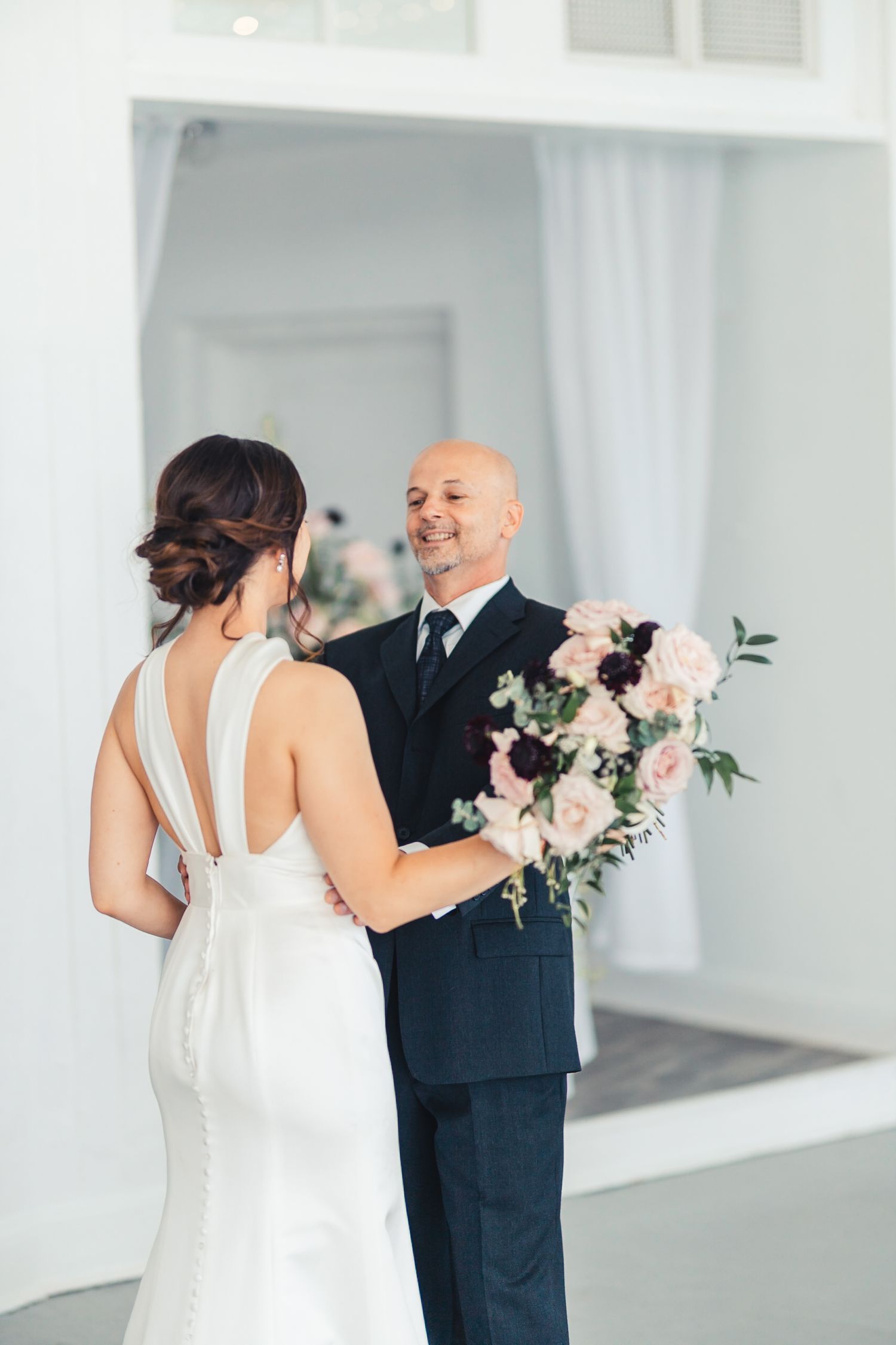 Bride sharing a special moment with father before ceremony in West Palm Beach Florida