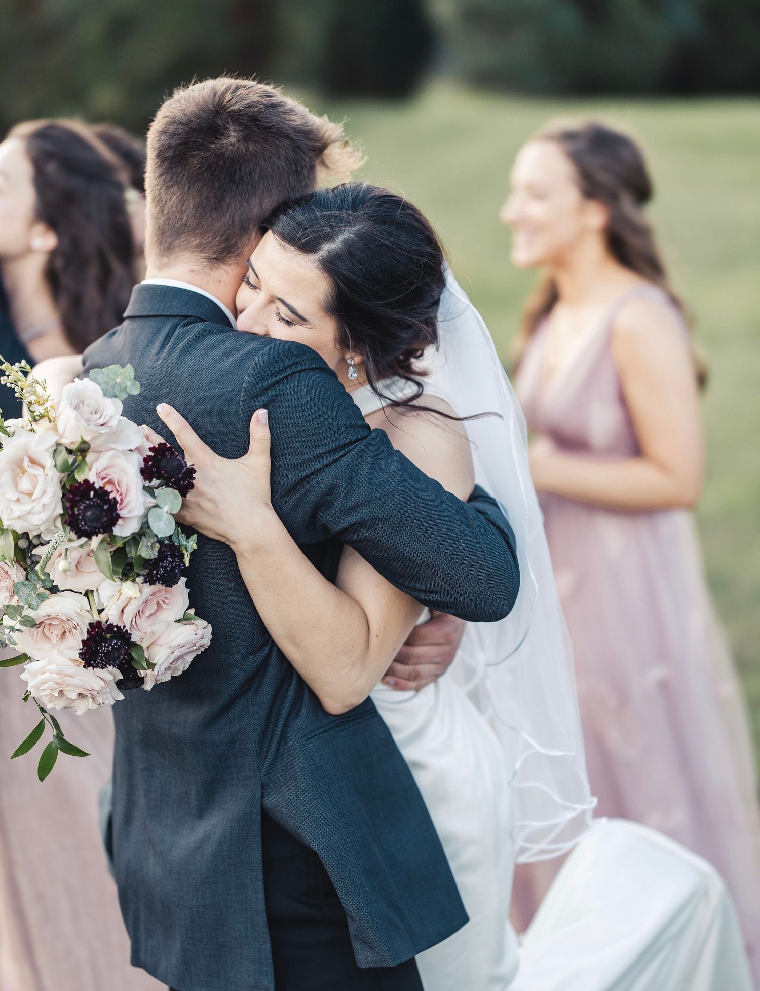Bride hugging groom during emotional wedding portrait in Palm Beach Gardens
