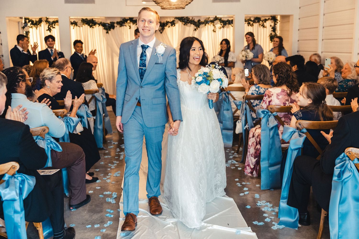 Bride and groom walking down aisle after ceremony in Palm Beach Gardens wedding