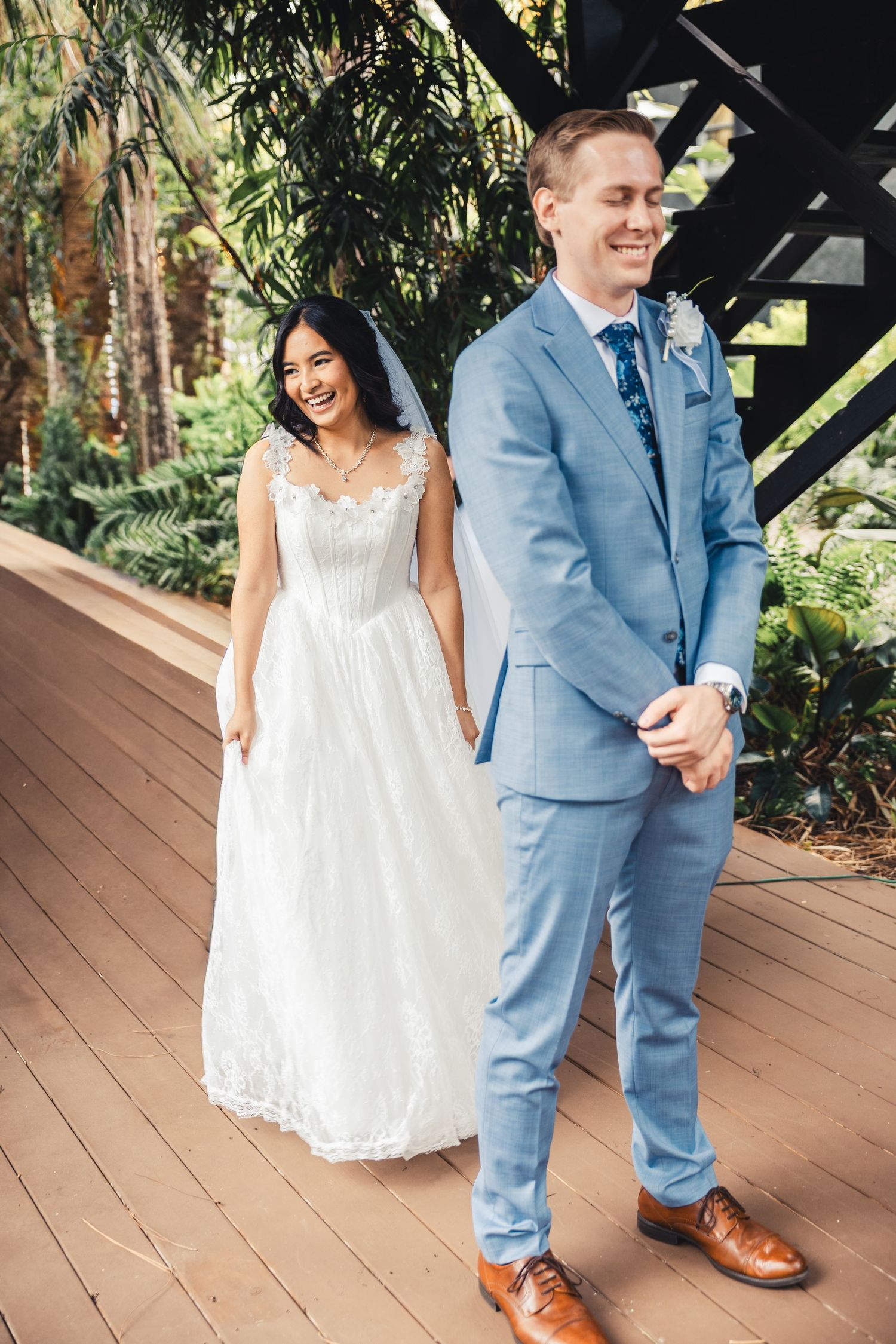 Bride approaching groom during first look at Palm Beach Gardens wedding