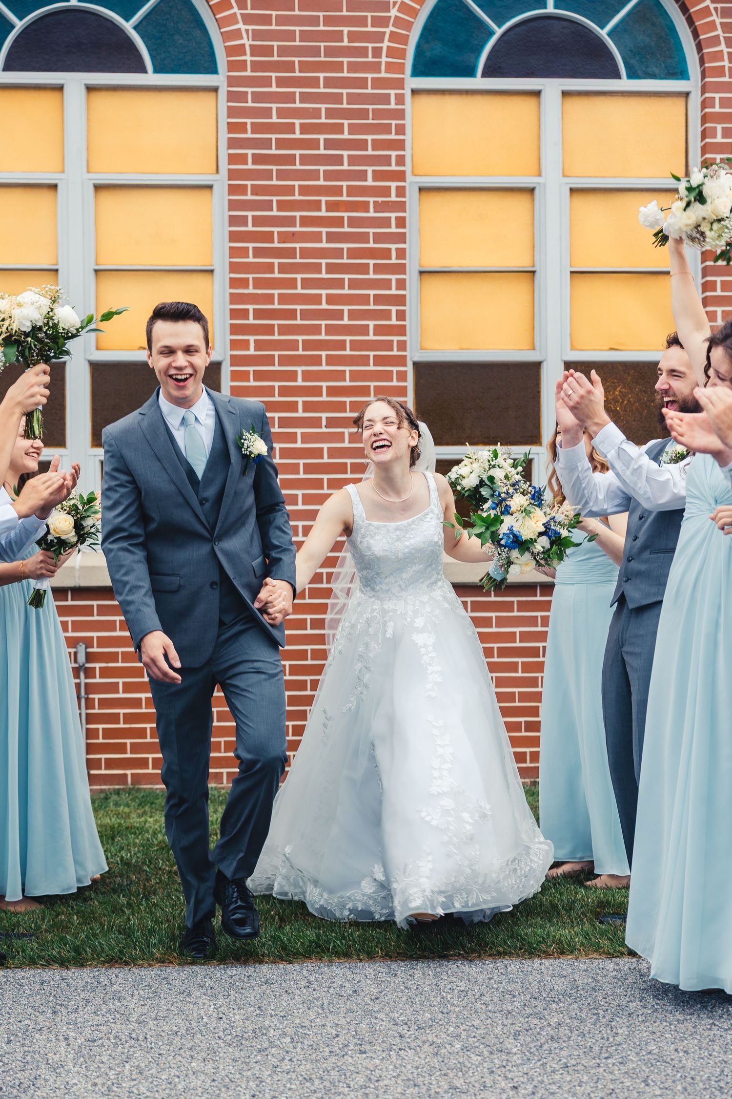 Bride and groom celebrating with wedding party after ceremony in Palm Beach Gardens