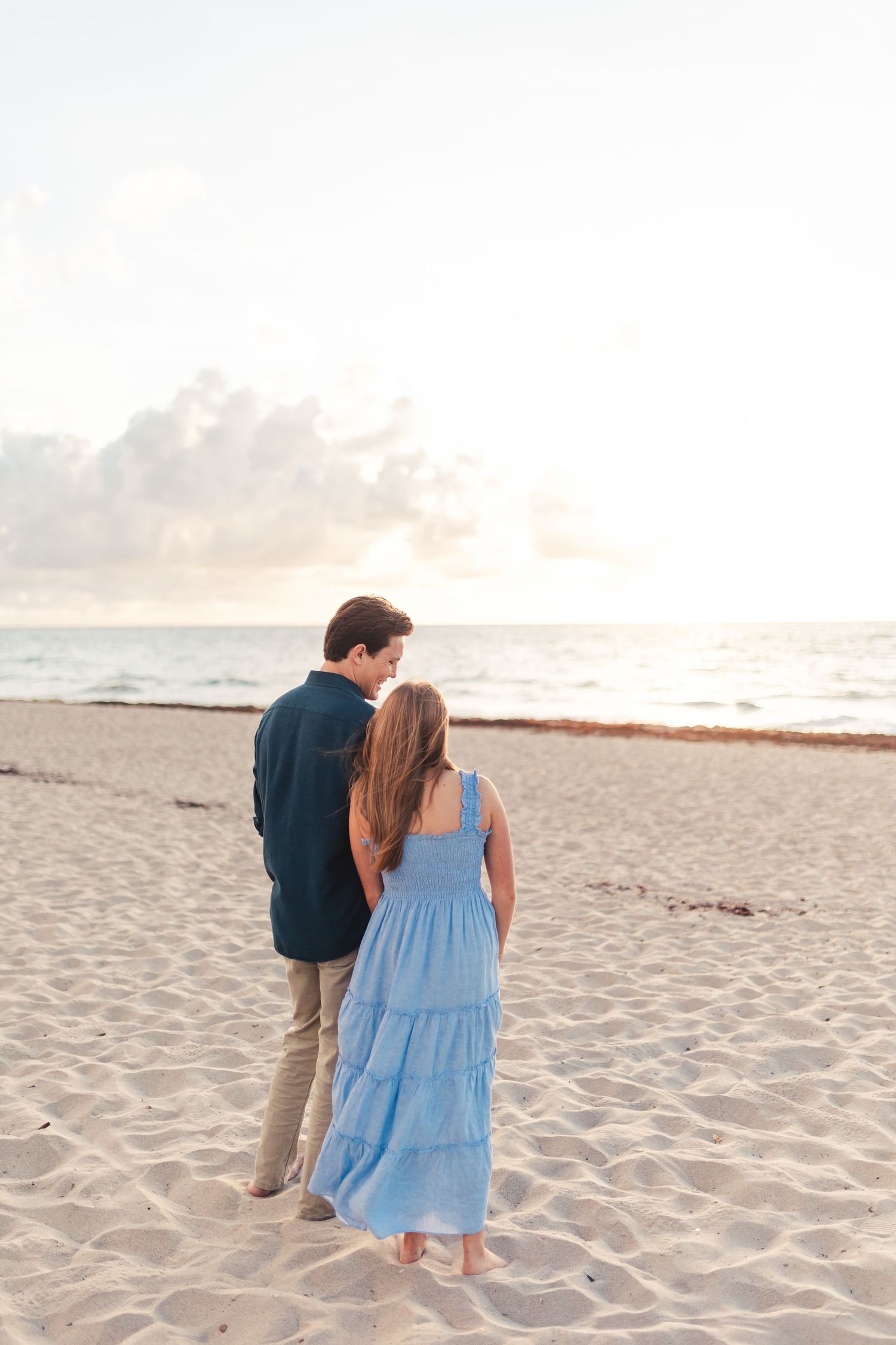 Couple walking on the beach during West Palm Beach Florida engagement session