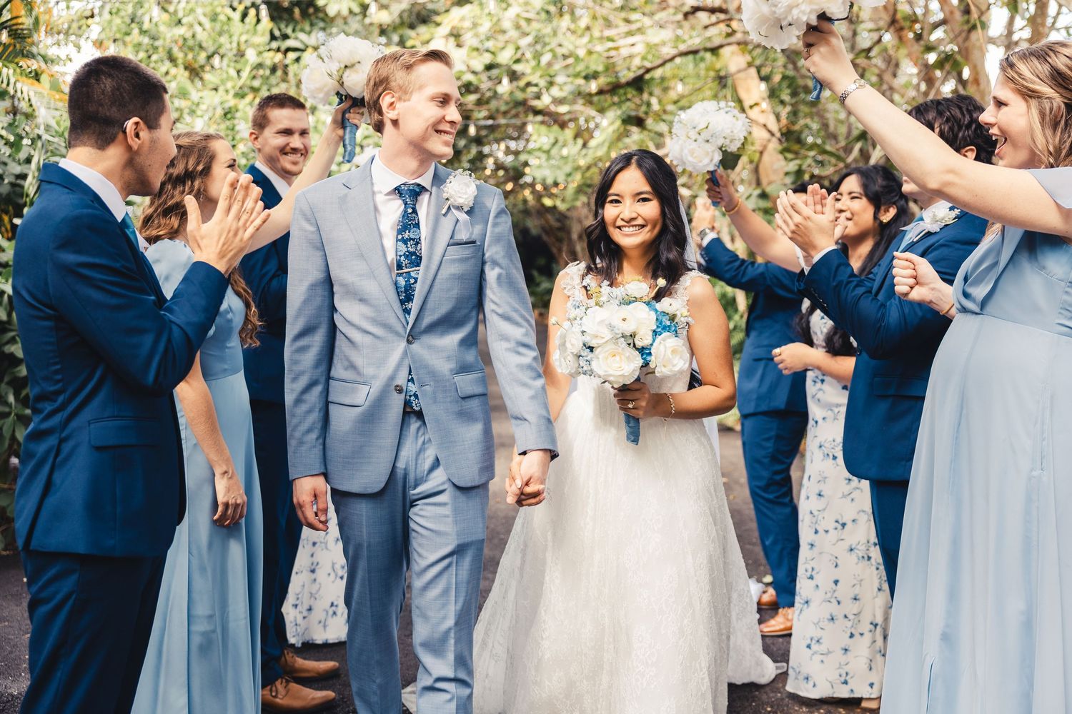 Wedding party cheering bride and groom after ceremony in Palm Beach Gardens