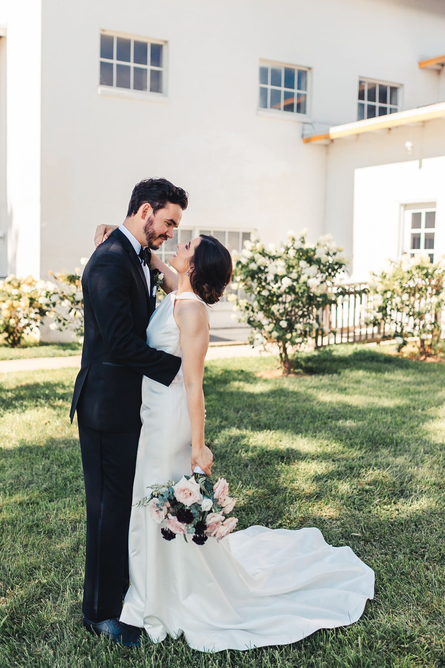 Bride and groom sharing romantic outdoor portrait in Palm Beach Gardens wedding