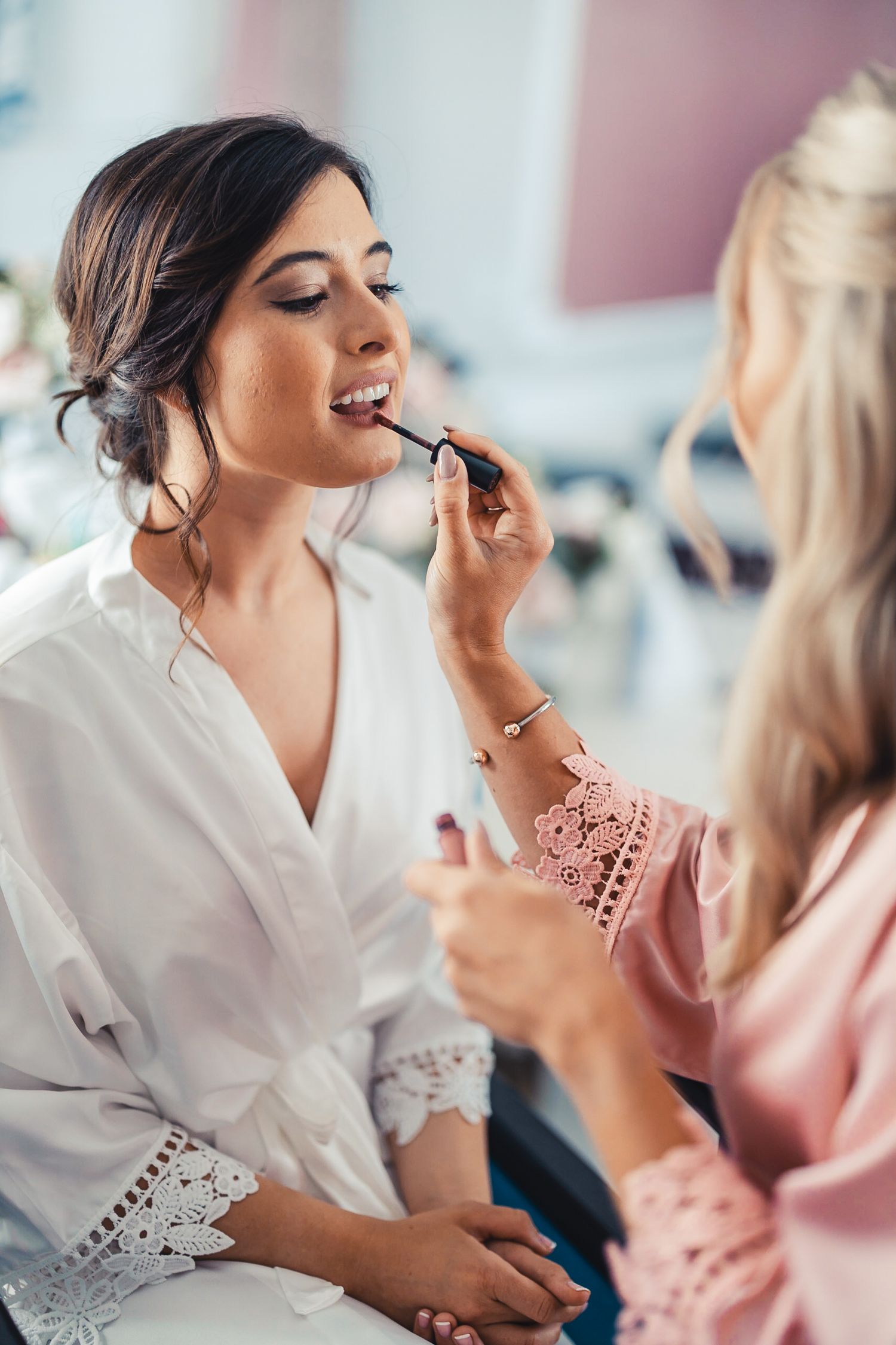 Bride getting makeup done during wedding getting ready in West Palm Beach Florida