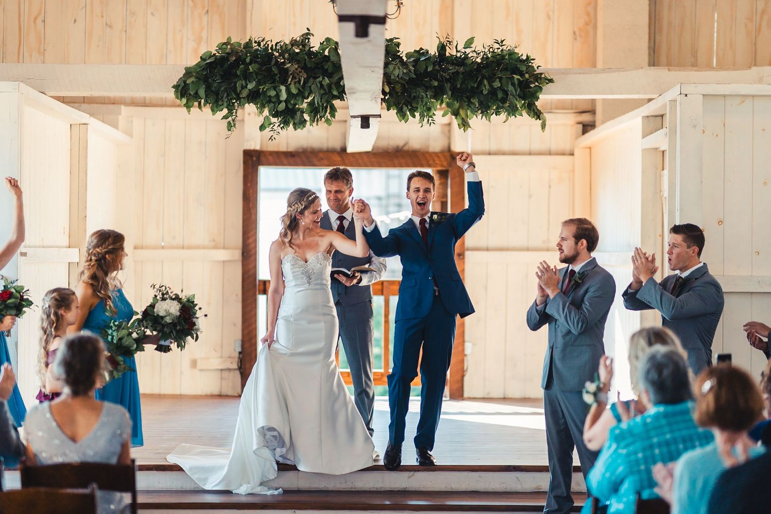 Bride and groom celebrating ceremony moment at Palm Beach Gardens wedding