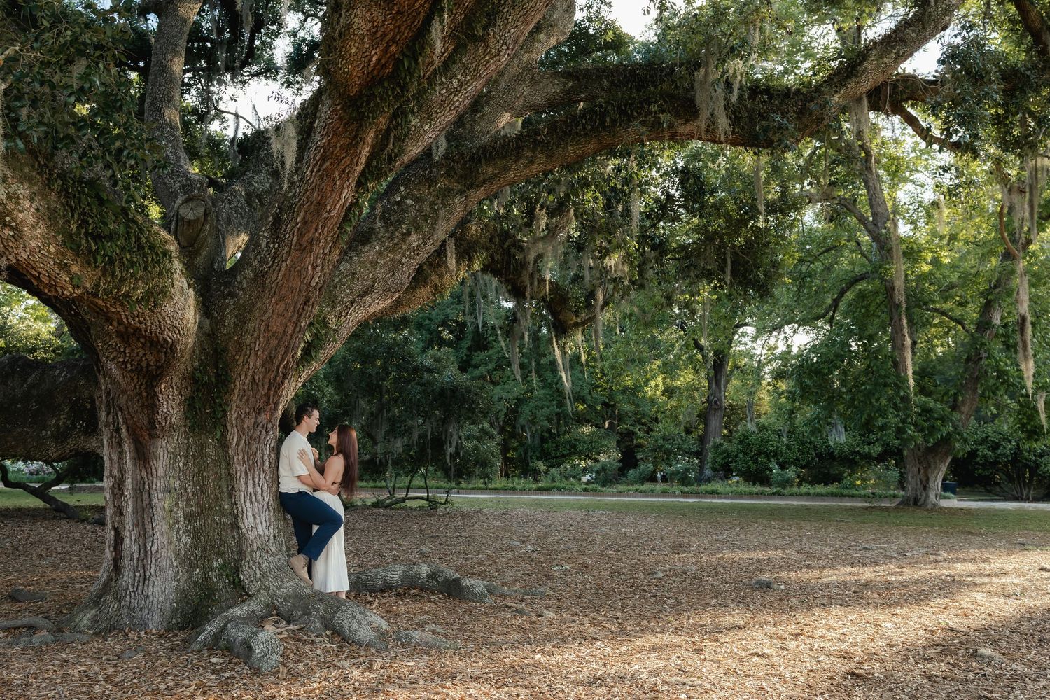 Golden hour proposal moment in Hampton Park with joyful reaction and romantic scenery