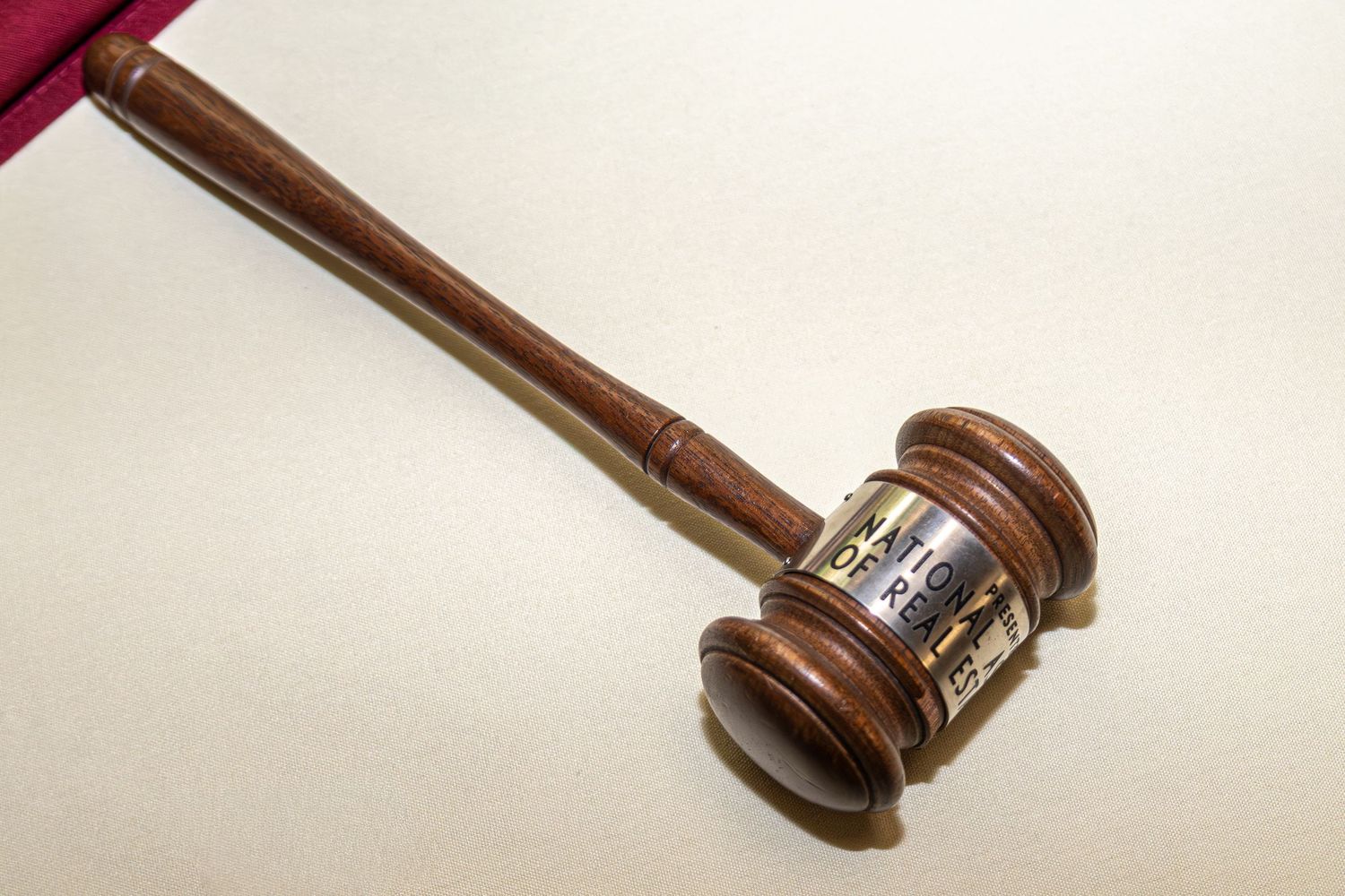 Wooden gavel on white background photographed from multiple angles.