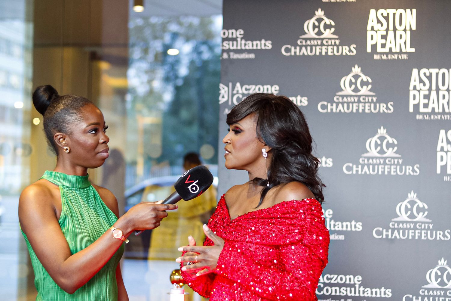 Red carpet backdrop with sponsor logos at an entertainment industry event.
